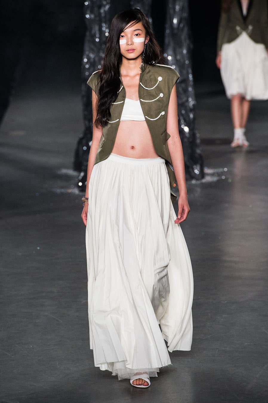 green fitted top and white tiered skirt