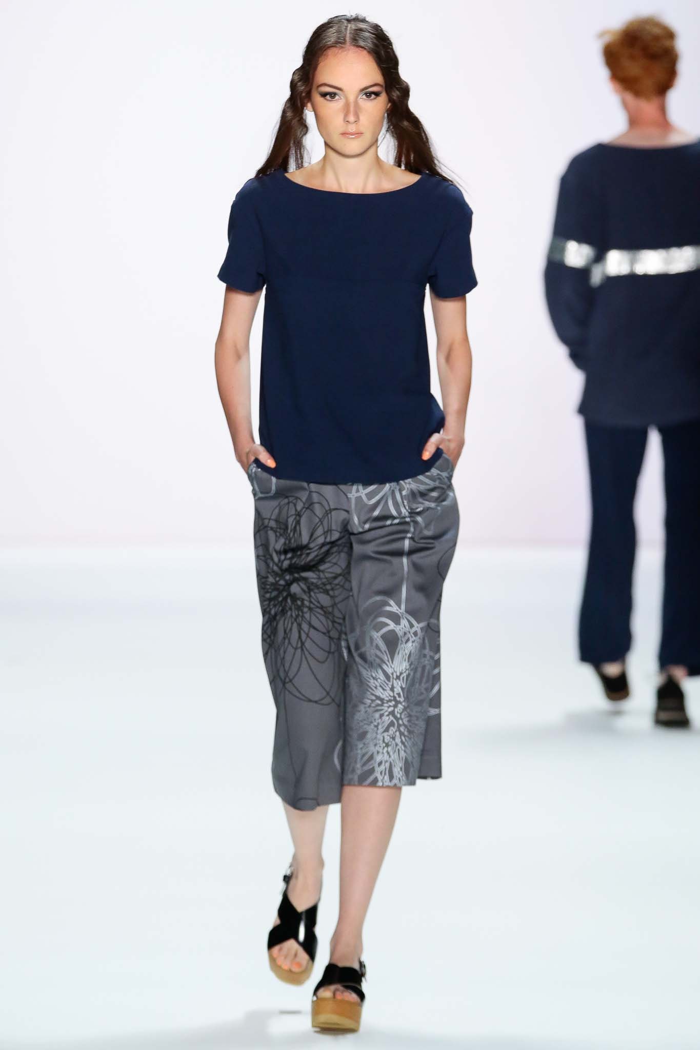 blue fitted top with gray pants