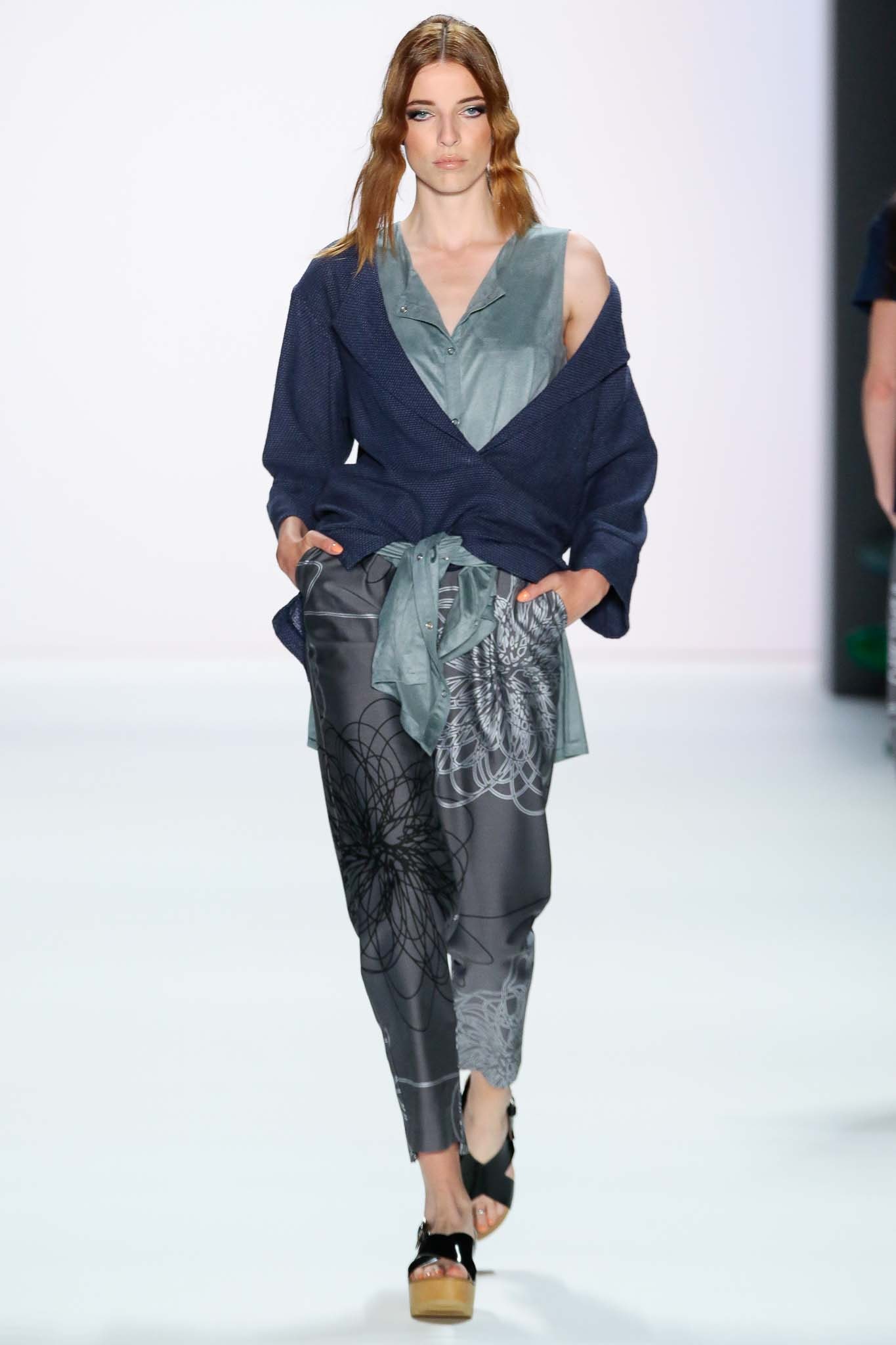 blue silk sleeveless top with gray printed pants