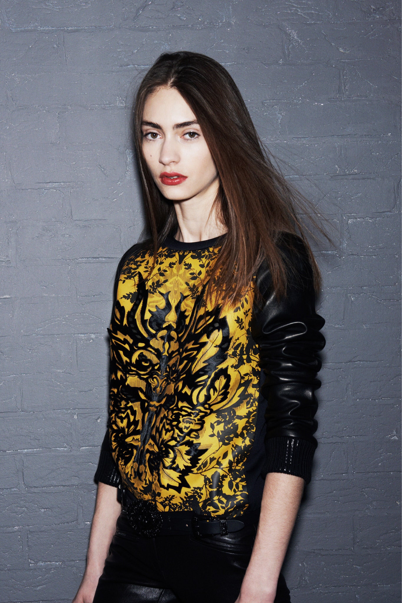 fitted black leather pants with printed top