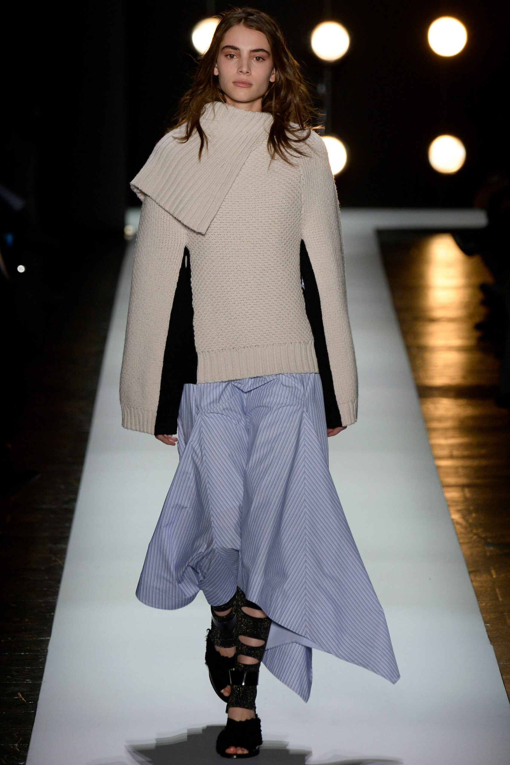 white relaxed sweater with blue skirt