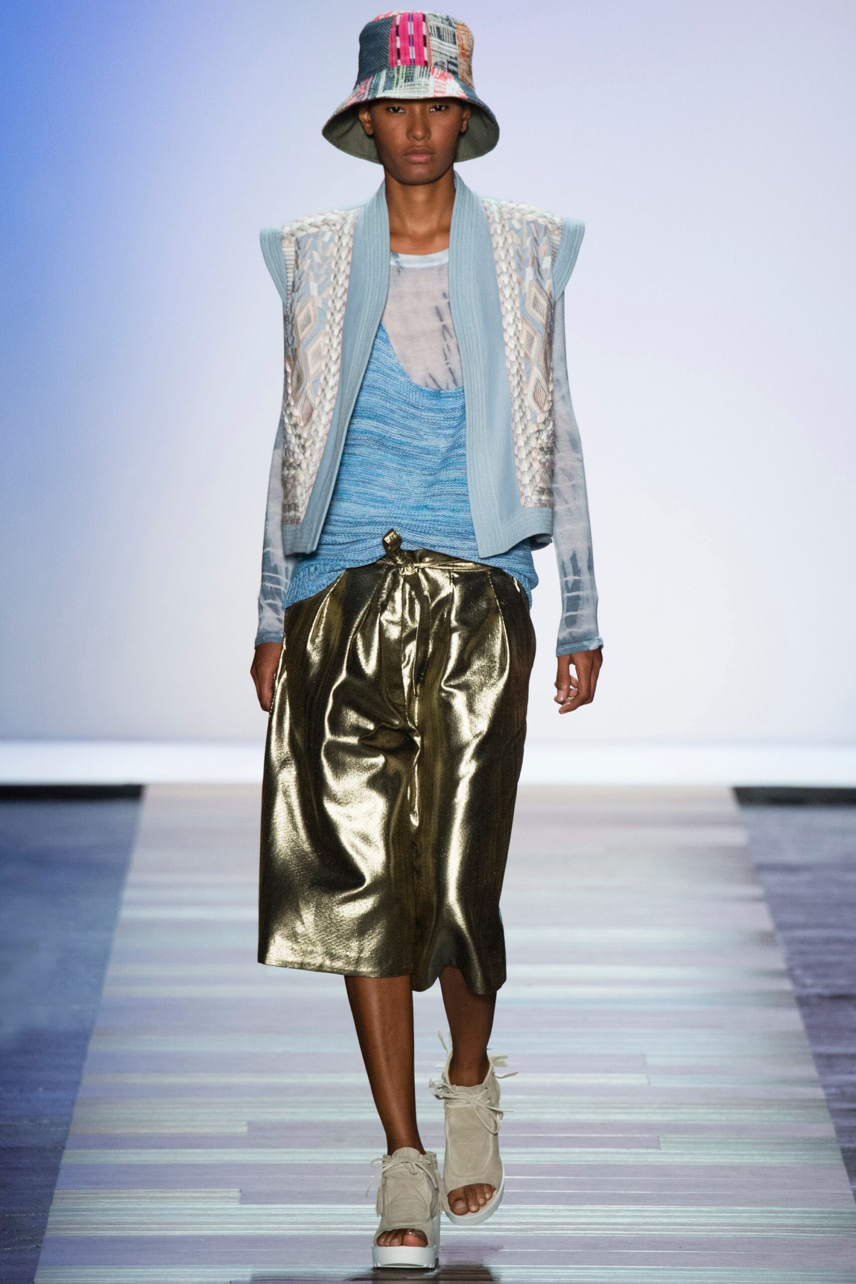 blue embroidered vest with metallic skirt