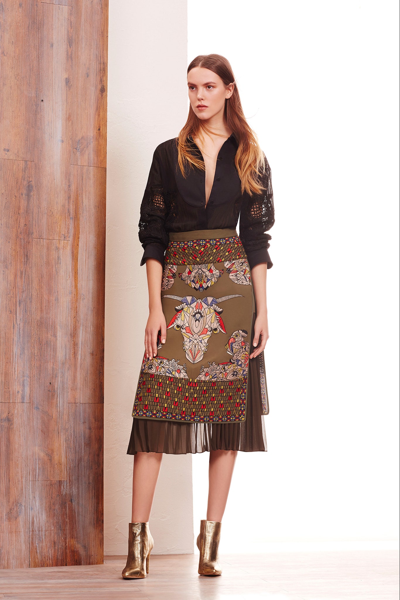 black blouse green printed skirt