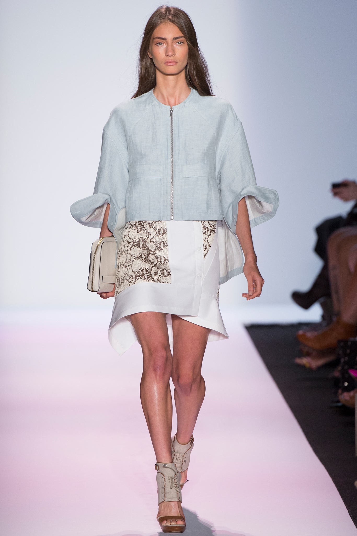 light blue relaxed jacket and white skirt