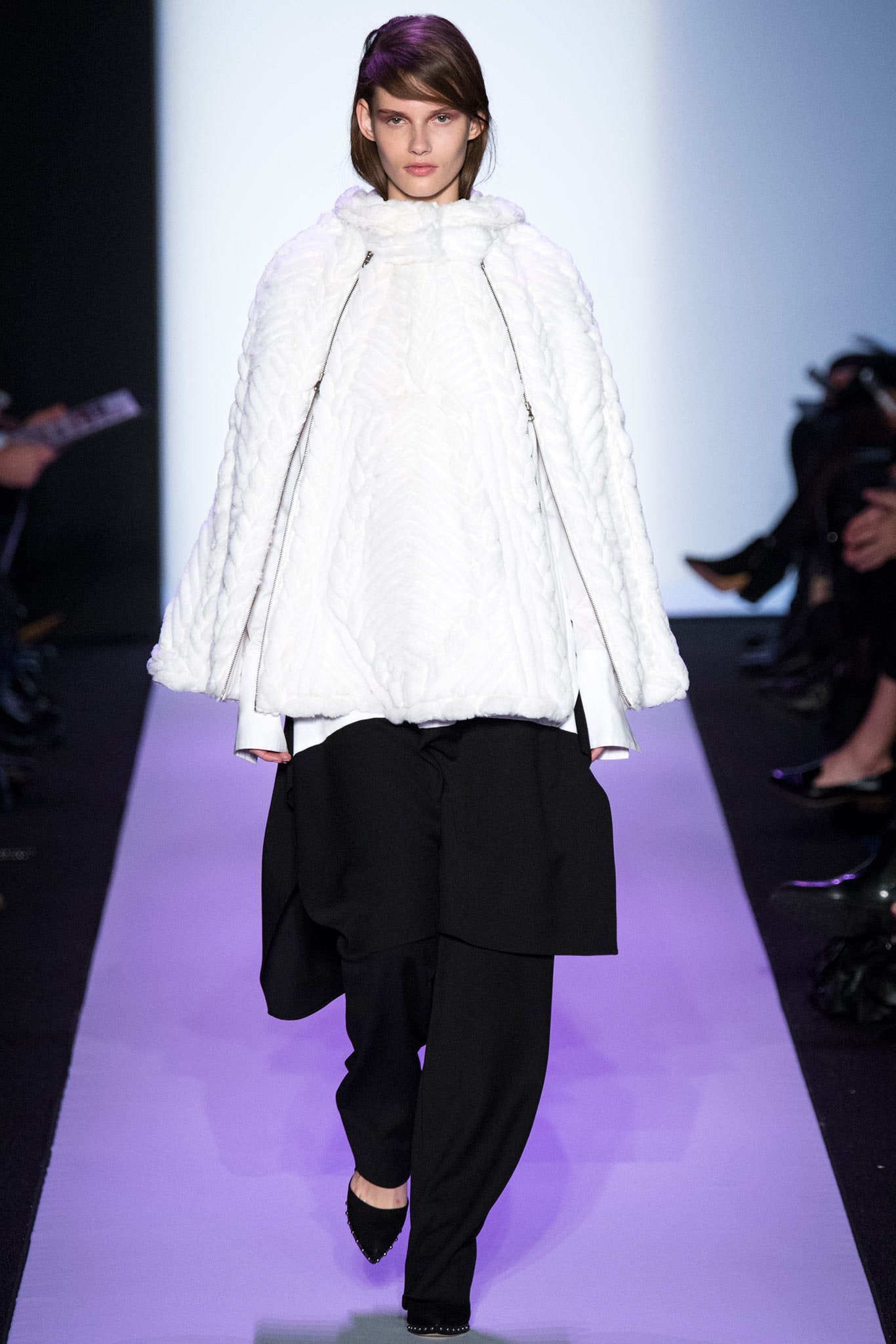 white wool cape and black pants