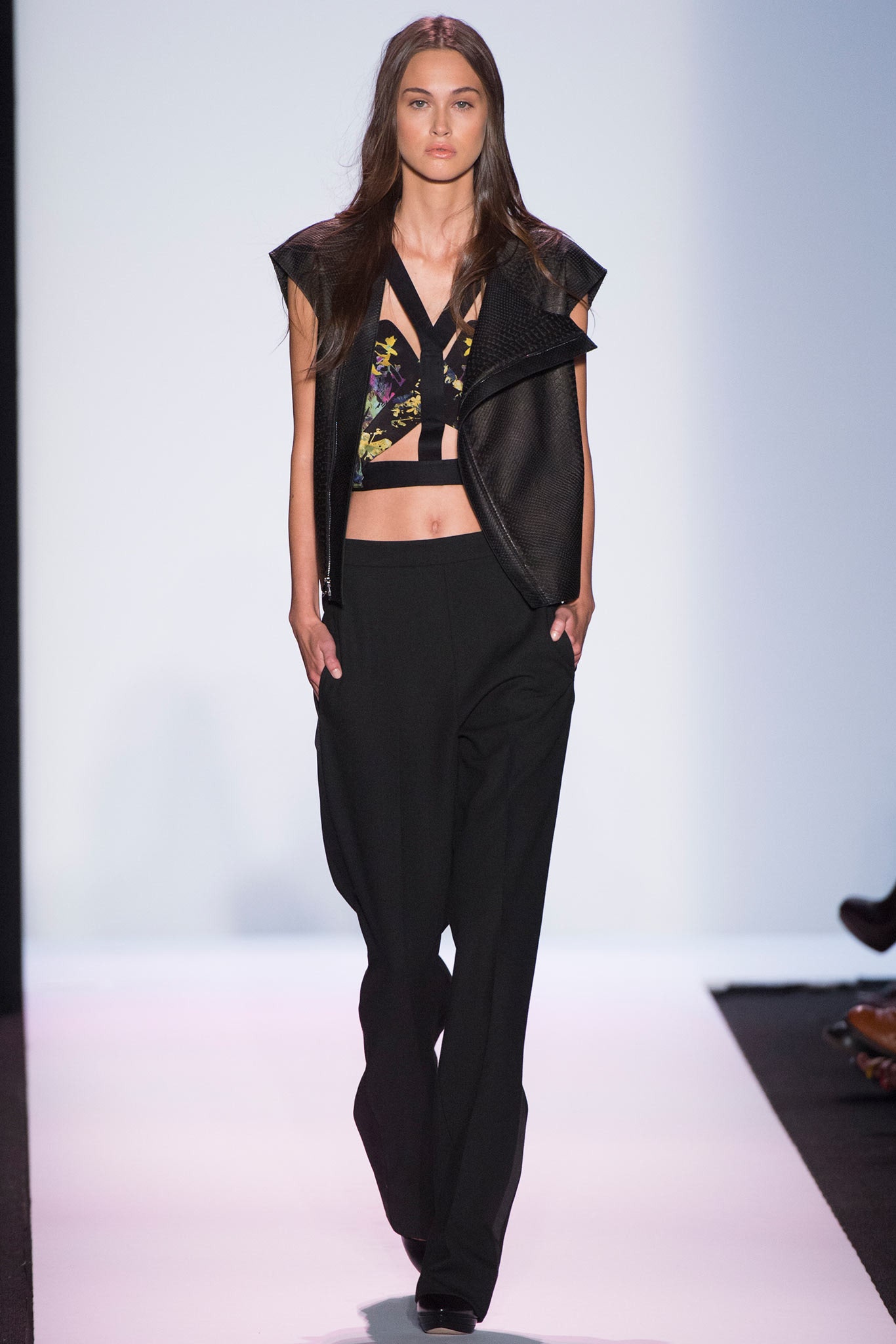 black leather sleeveless top and relaxed pants