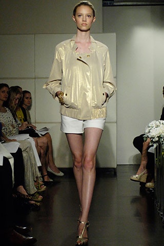 gold vinyl relaxed jacket with white shorts
