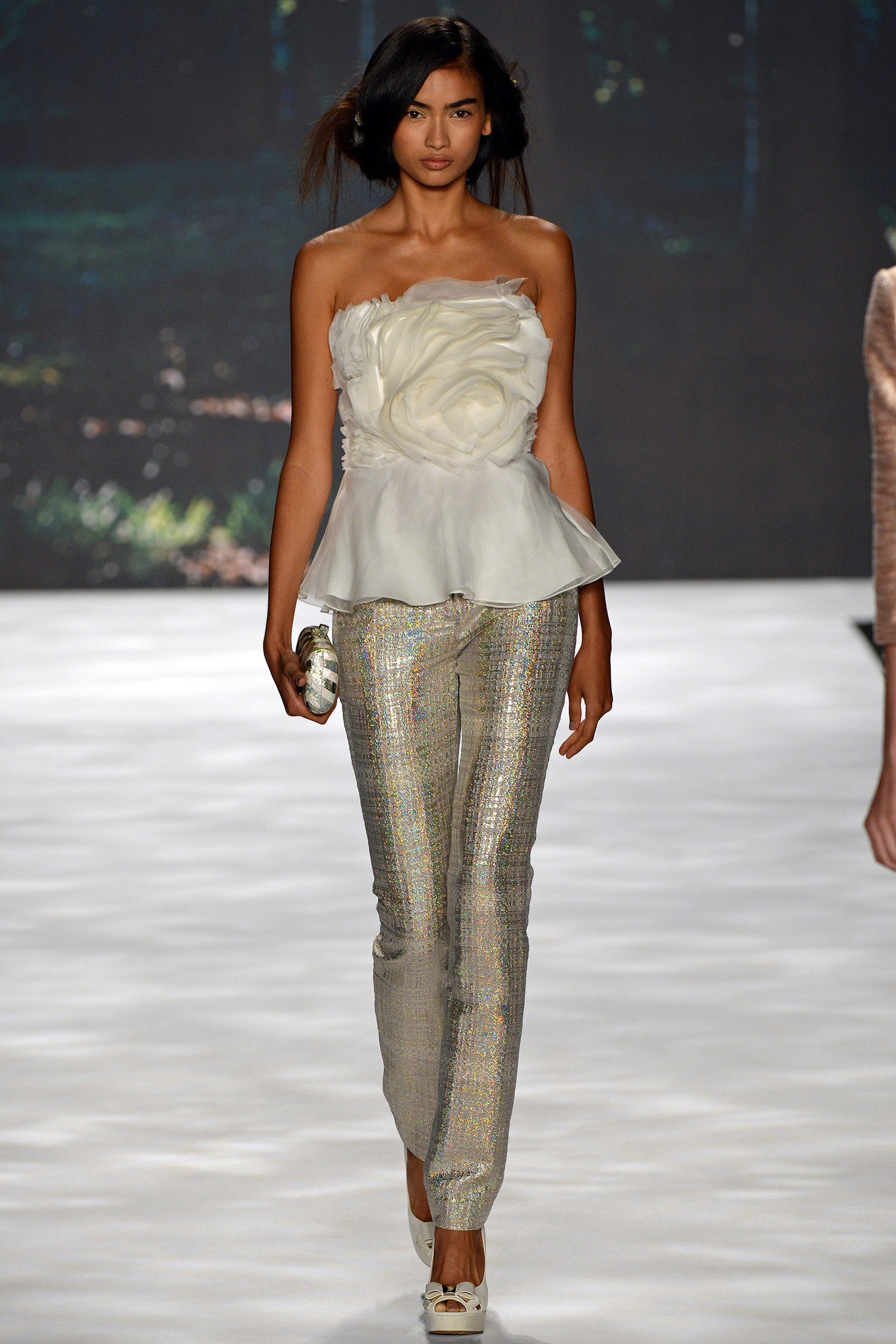 white ruffled top with silver pants