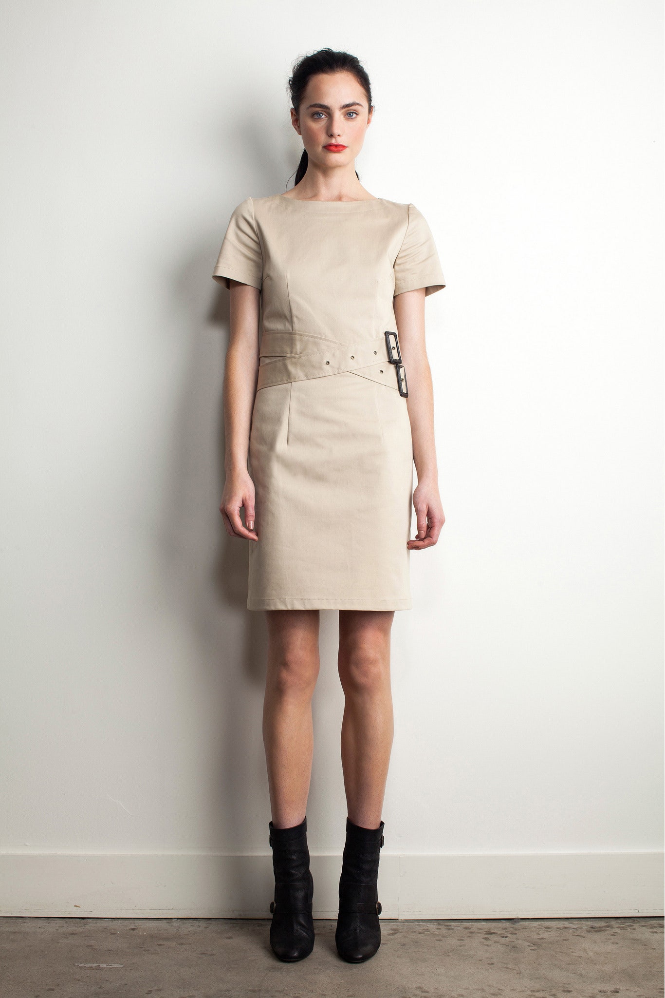beige leather fitted dress with black boots