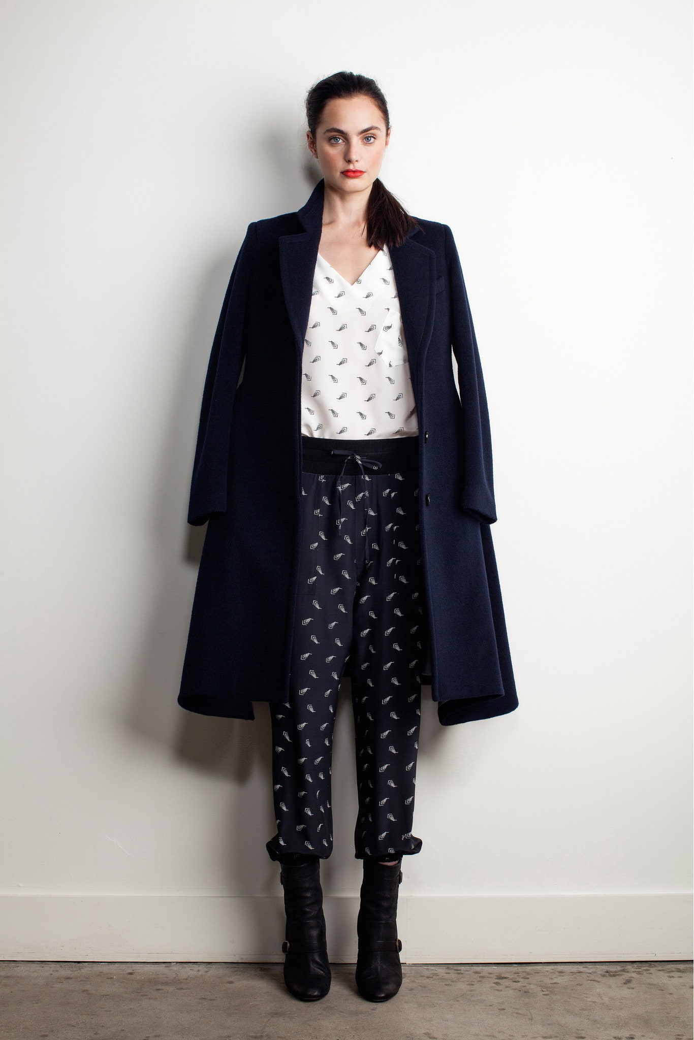 black wool coat with printed blouse and pants