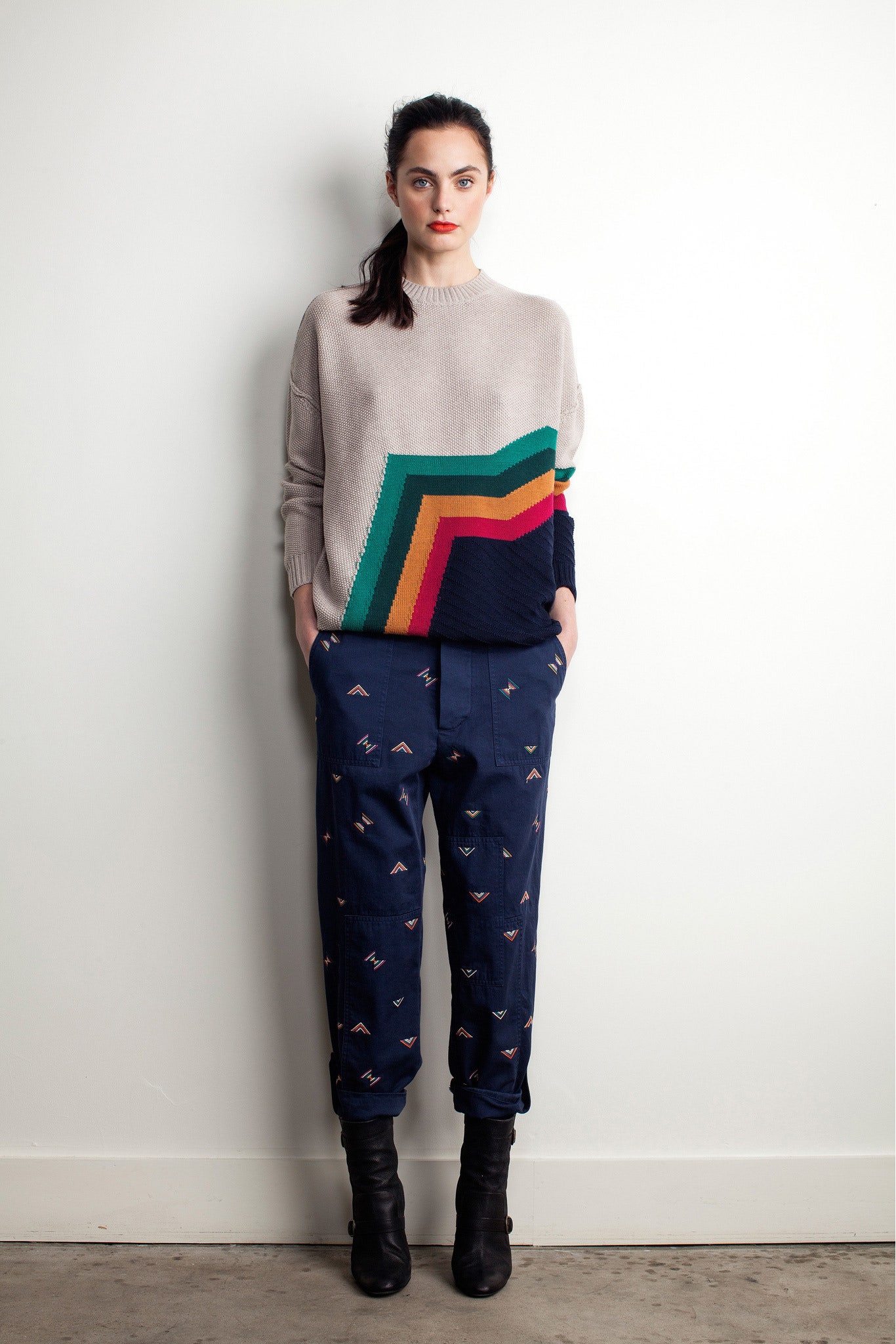 beige color-blocked sweater with navy pants