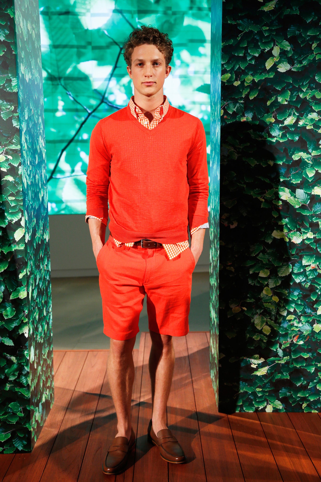 orange fitted sweater and shorts