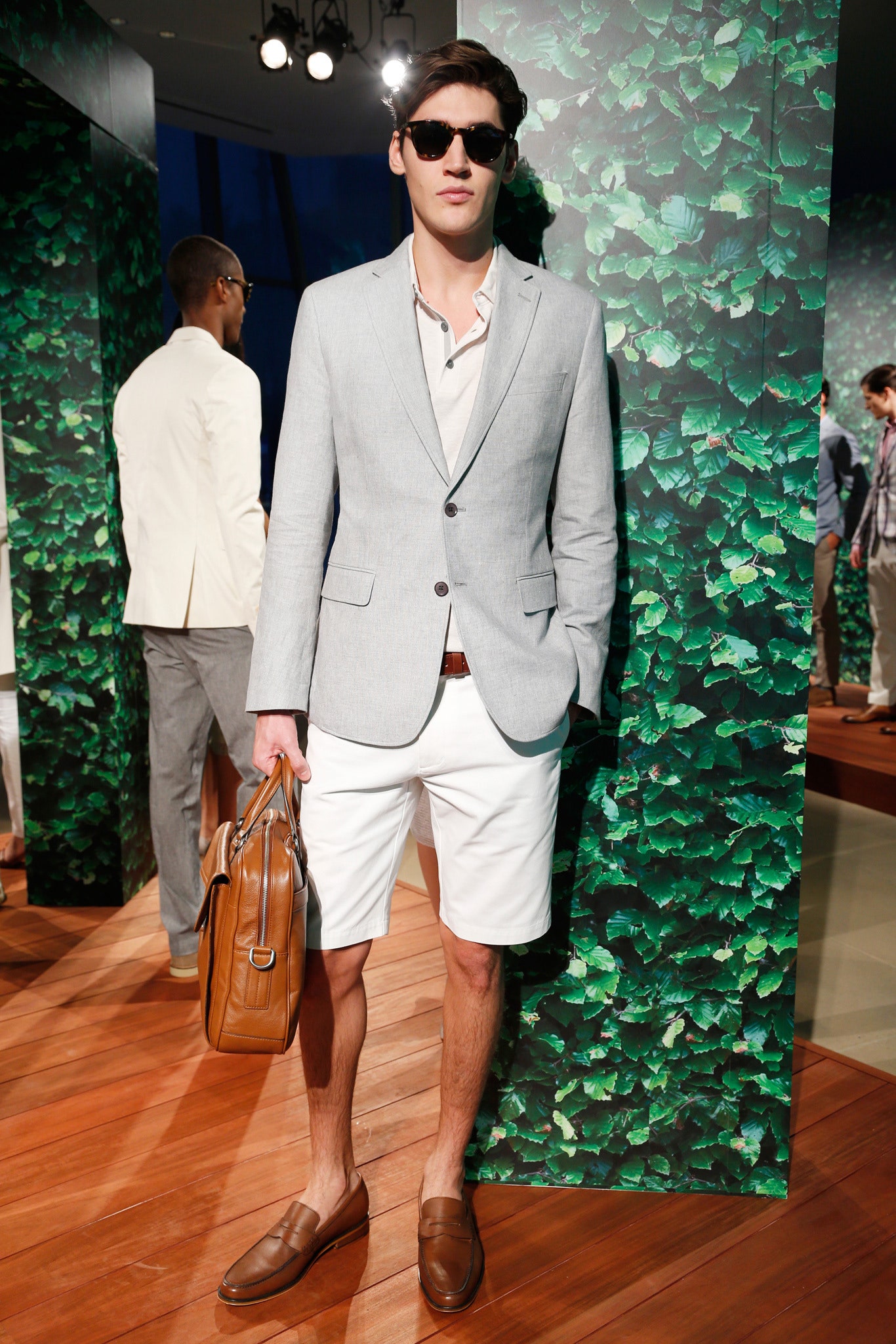 gray tailored blazer with white shorts