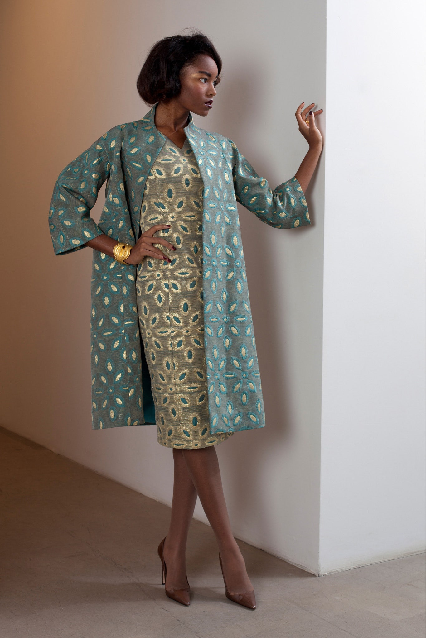 teal silk coat with beige dress