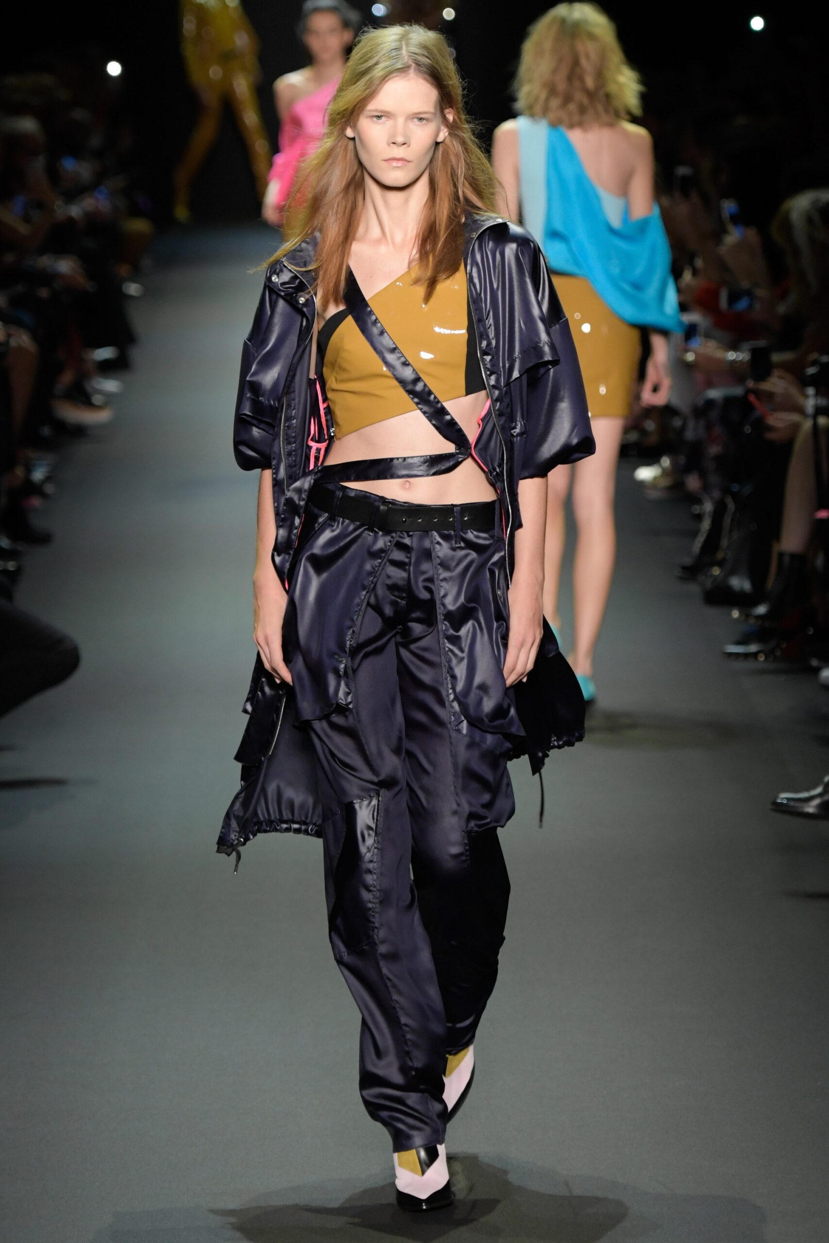 brown fitted sleeveless top and black relaxed pants