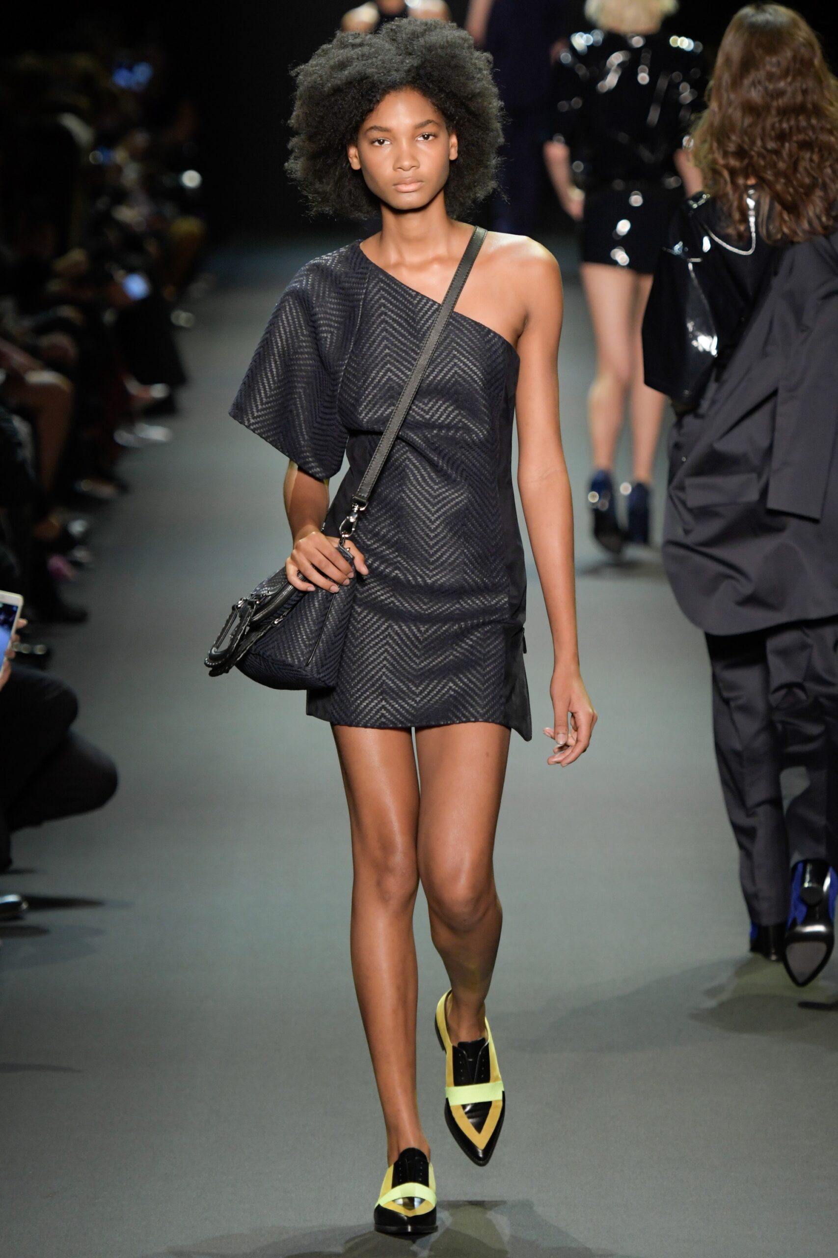 black asymmetric dress with yellow shoes