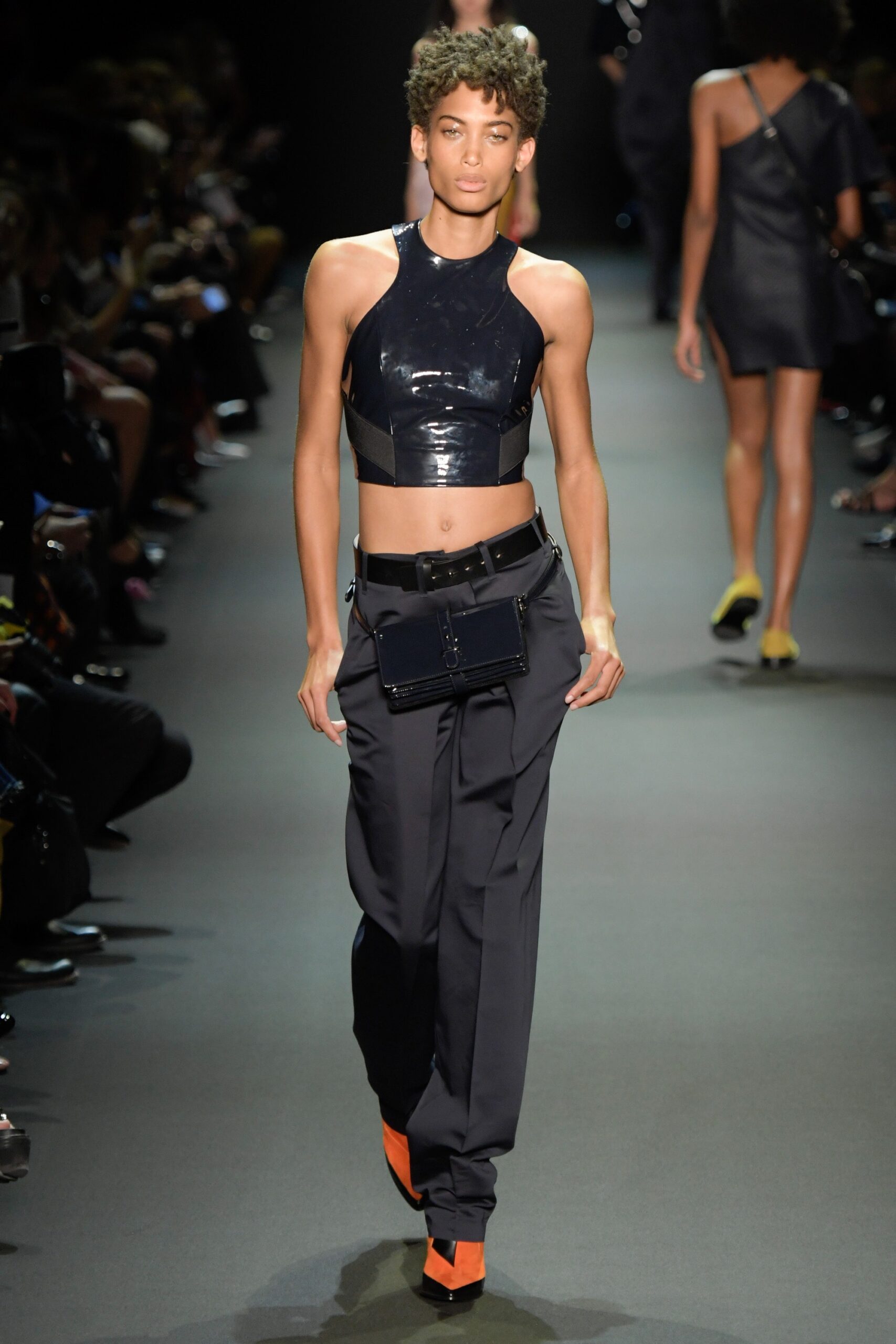 black vinyl sleeveless top with relaxed pants