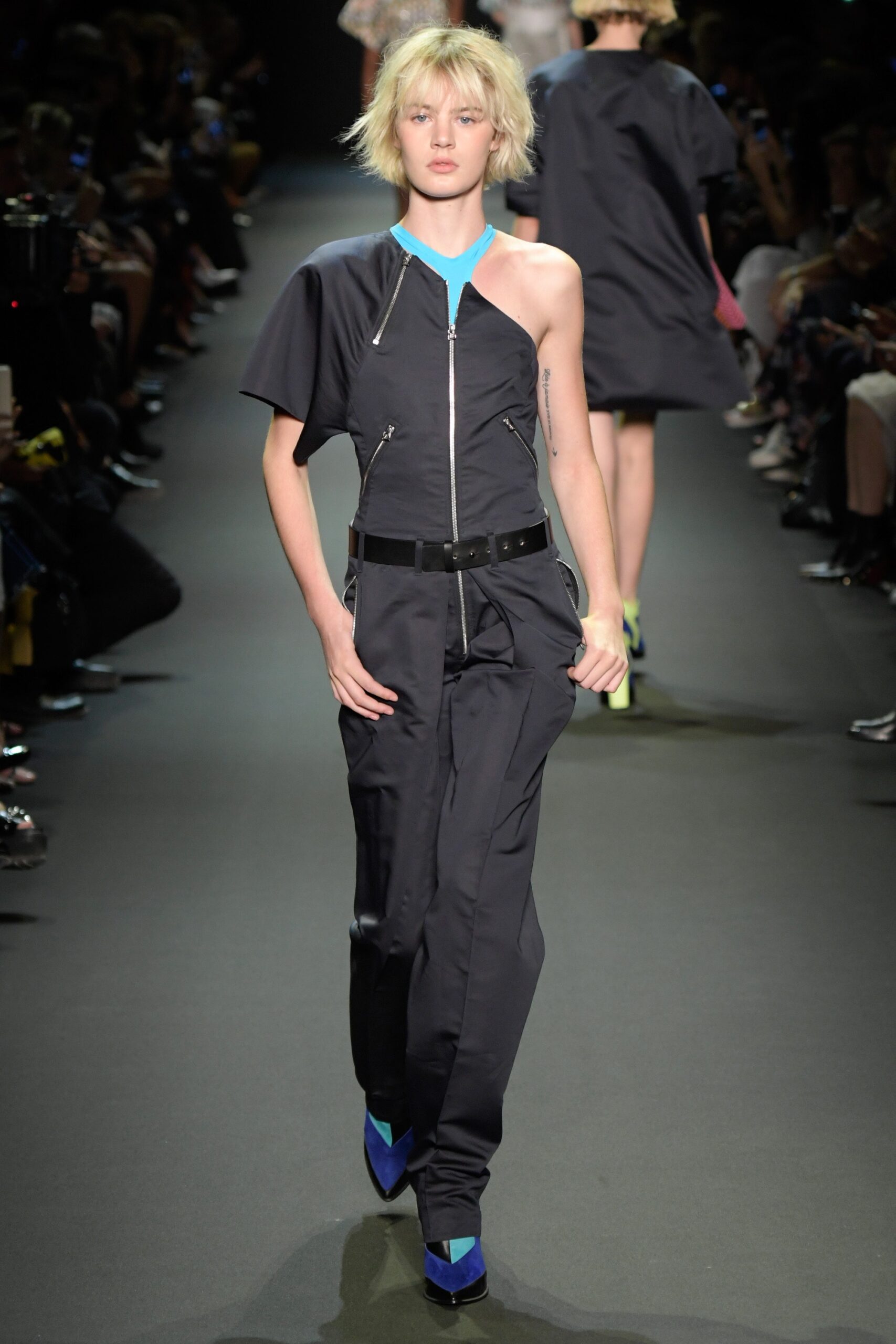 black fitted jumpsuit with blue shoes