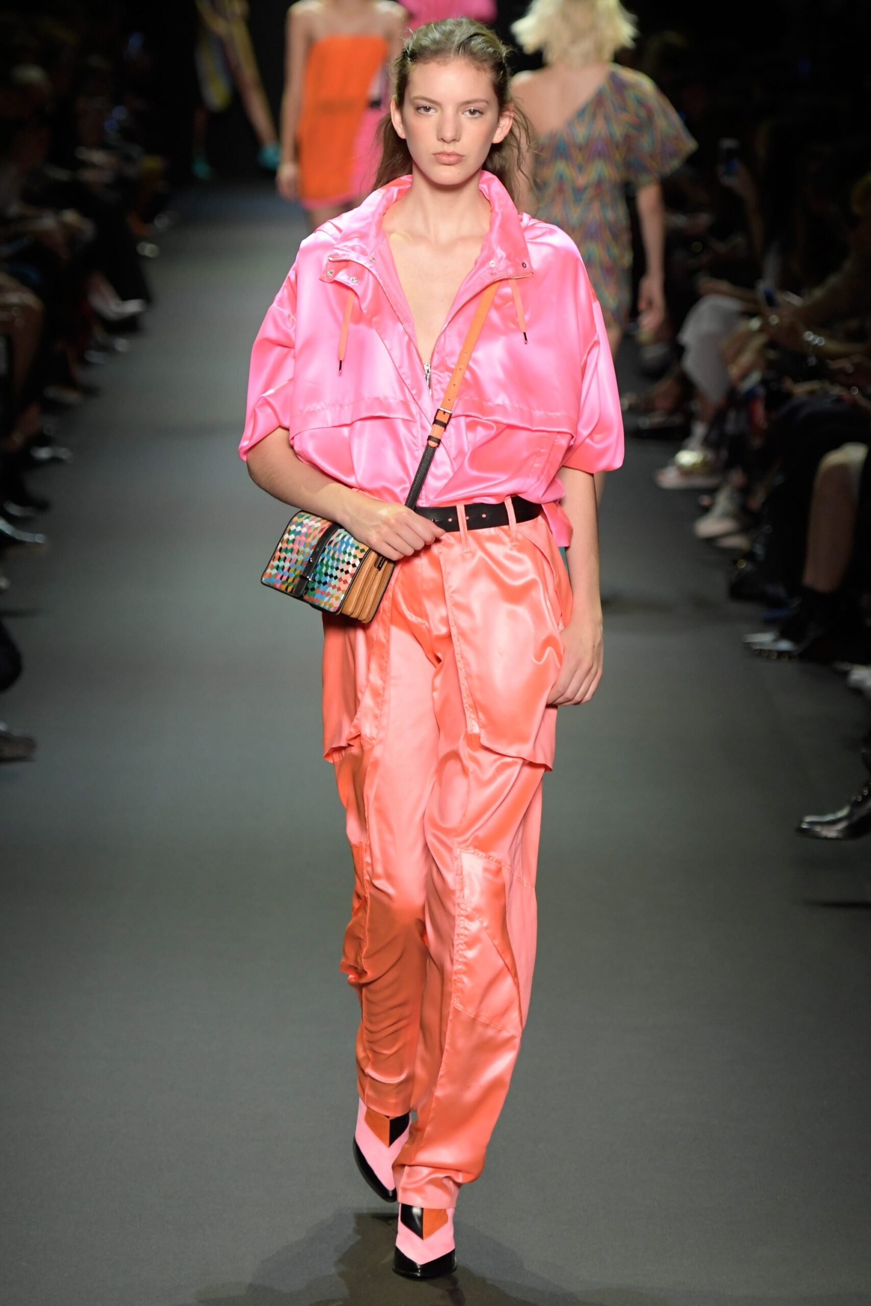 pink silk shirt and orange pants
