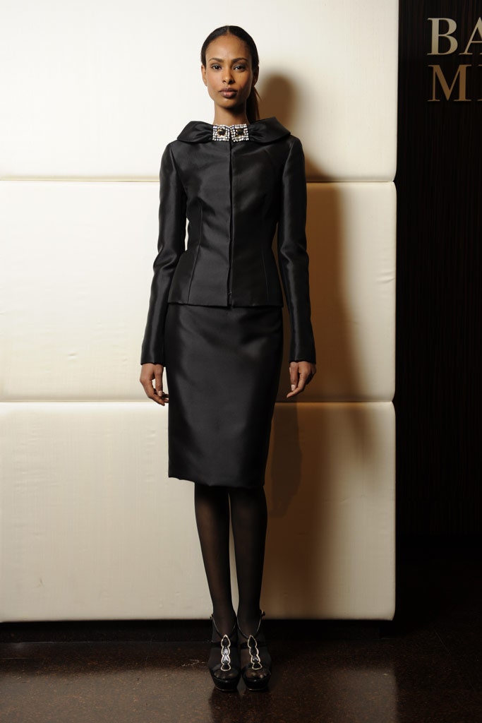 black fitted jacket and pencil skirt