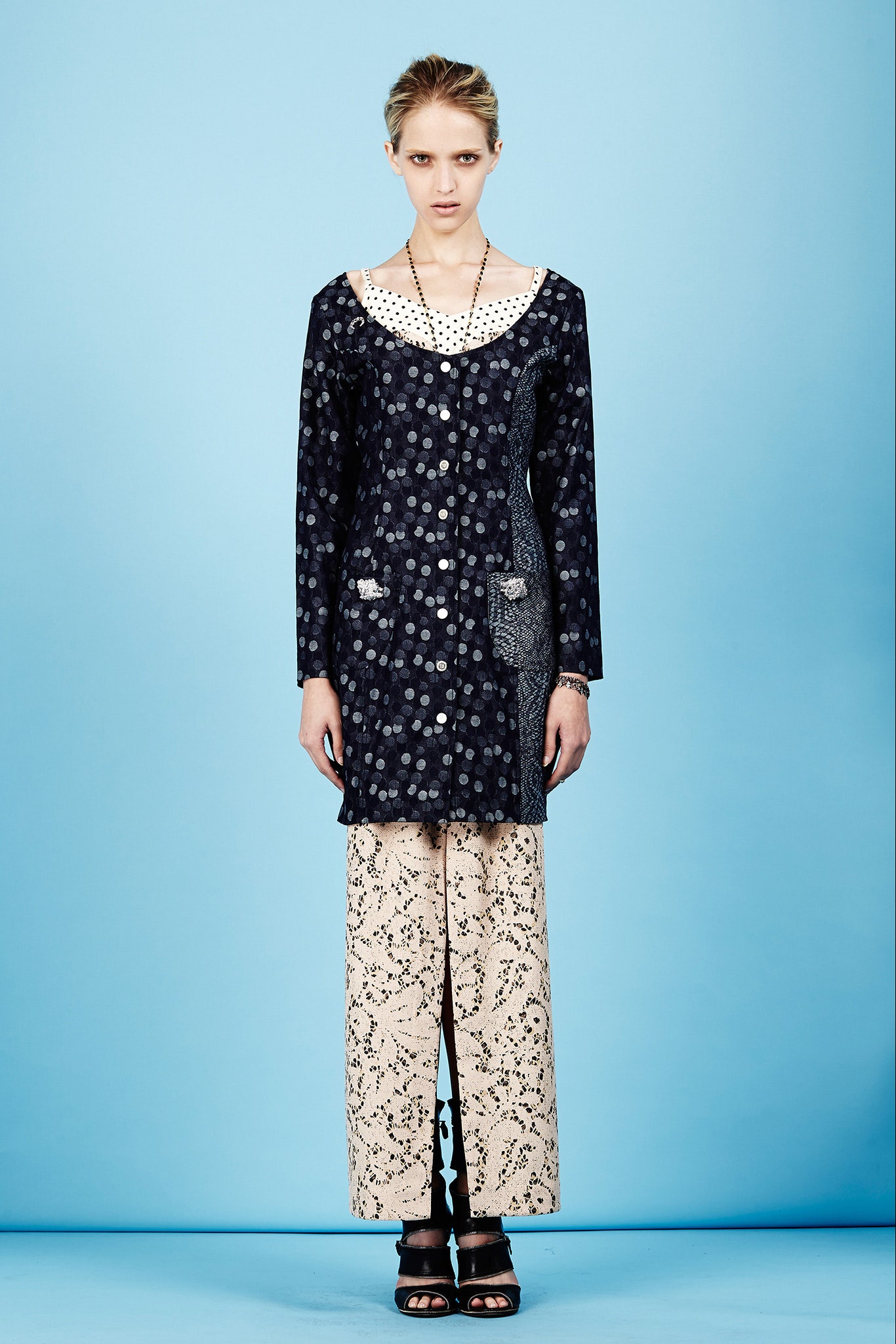 black relaxed top with beige lace pants