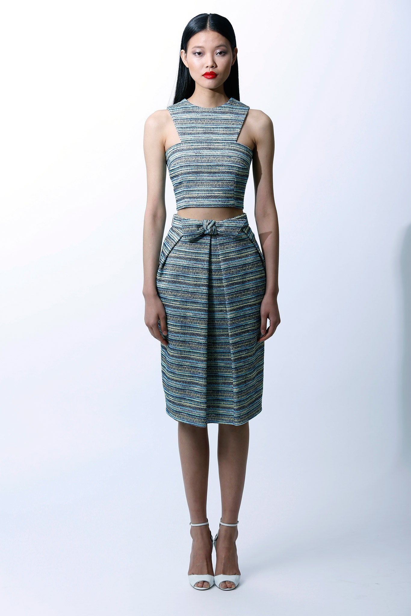 fitted blue and gold top with pencil skirt