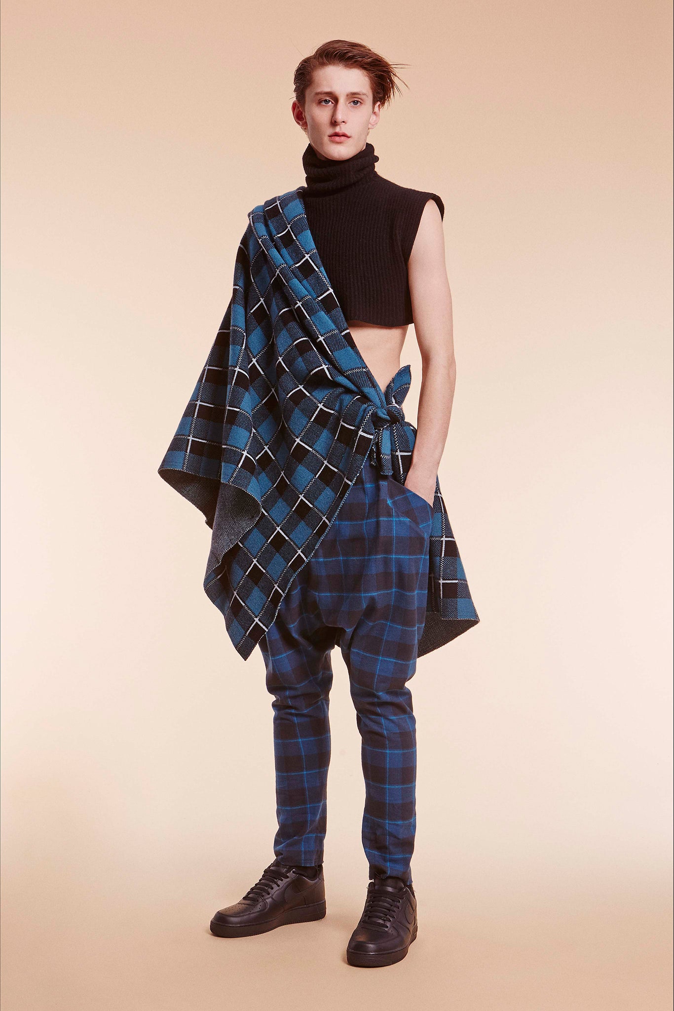 black fitted top with blue cape and pants