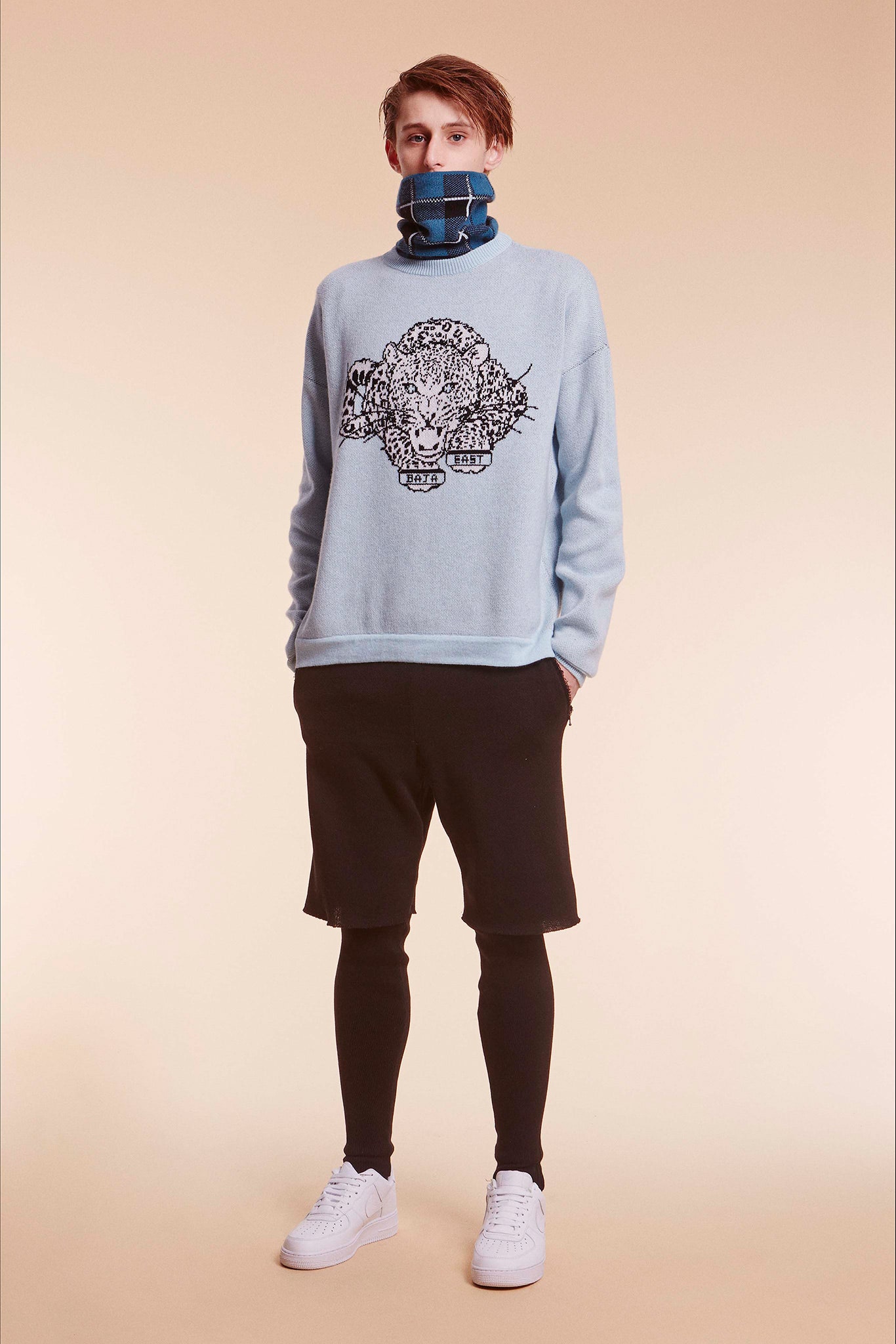 blue relaxed sweater with black shorts