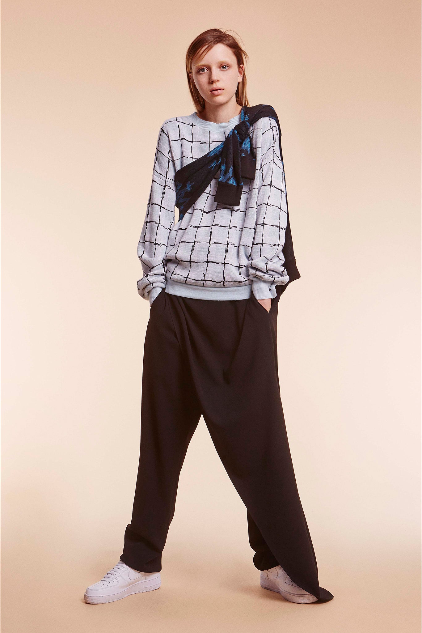 light blue checked sweater with black pants