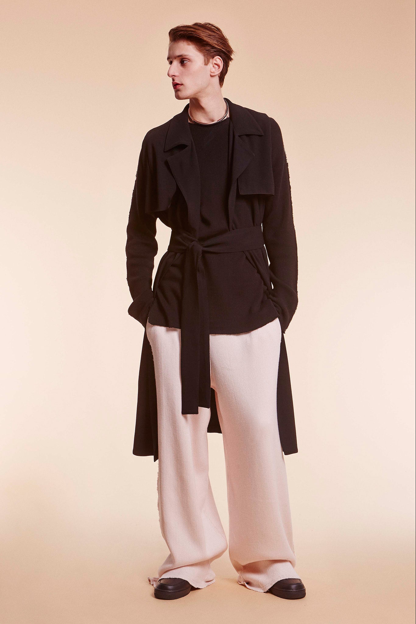 black coat with beige pants