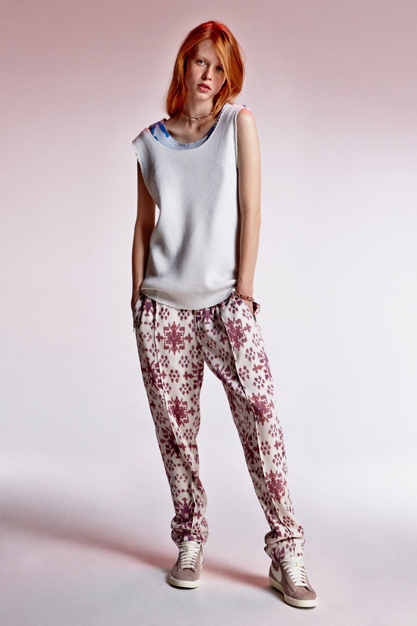 white relaxed top with printed pants