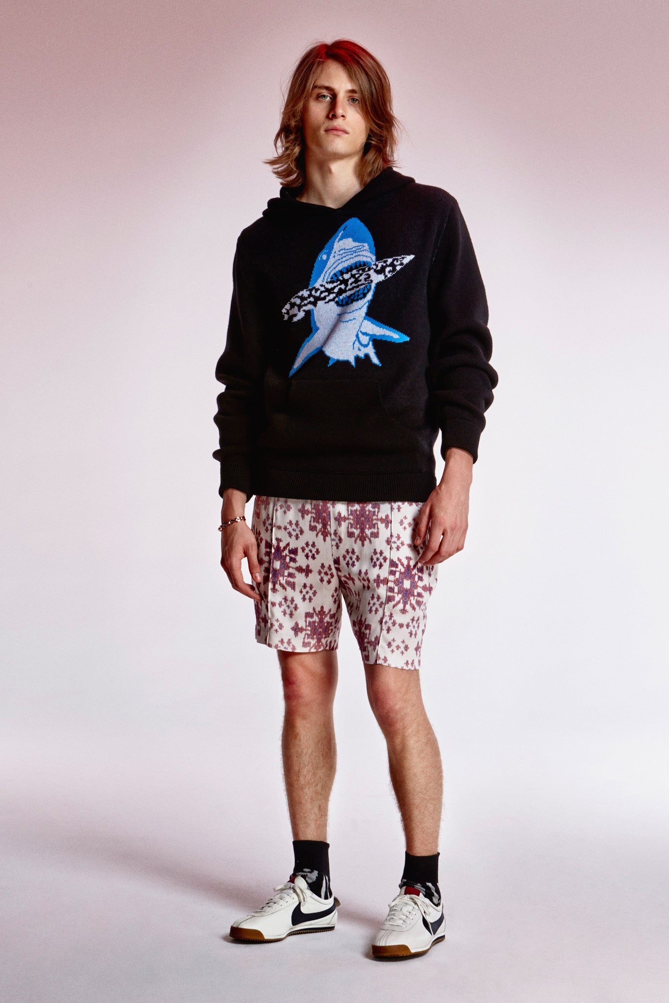 black hoodie and floral shorts