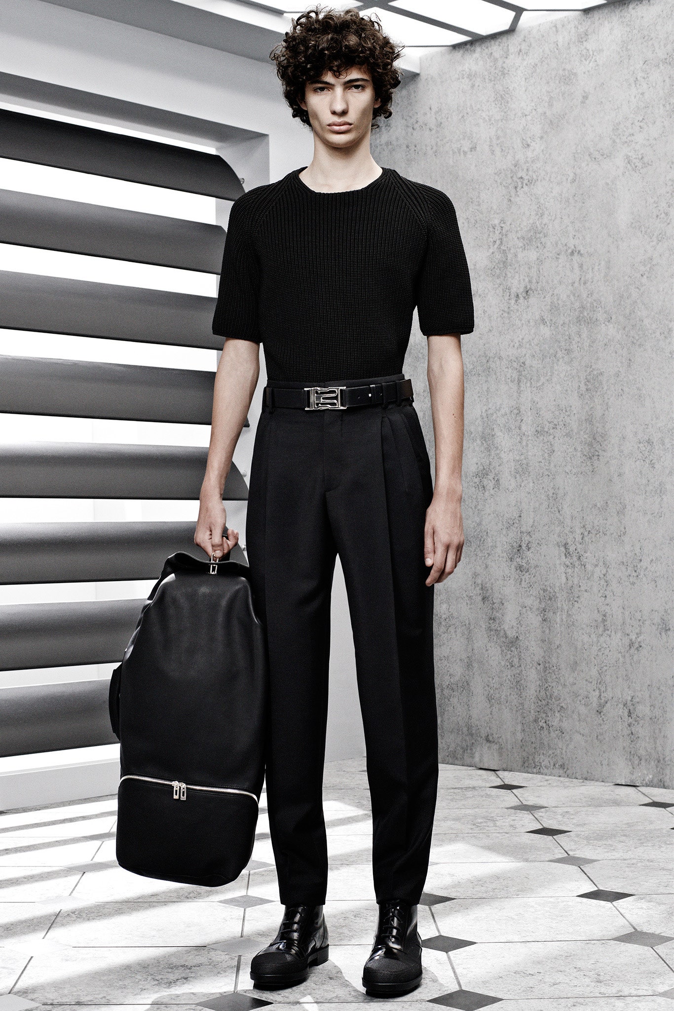 black fitted knit top and tailored pants