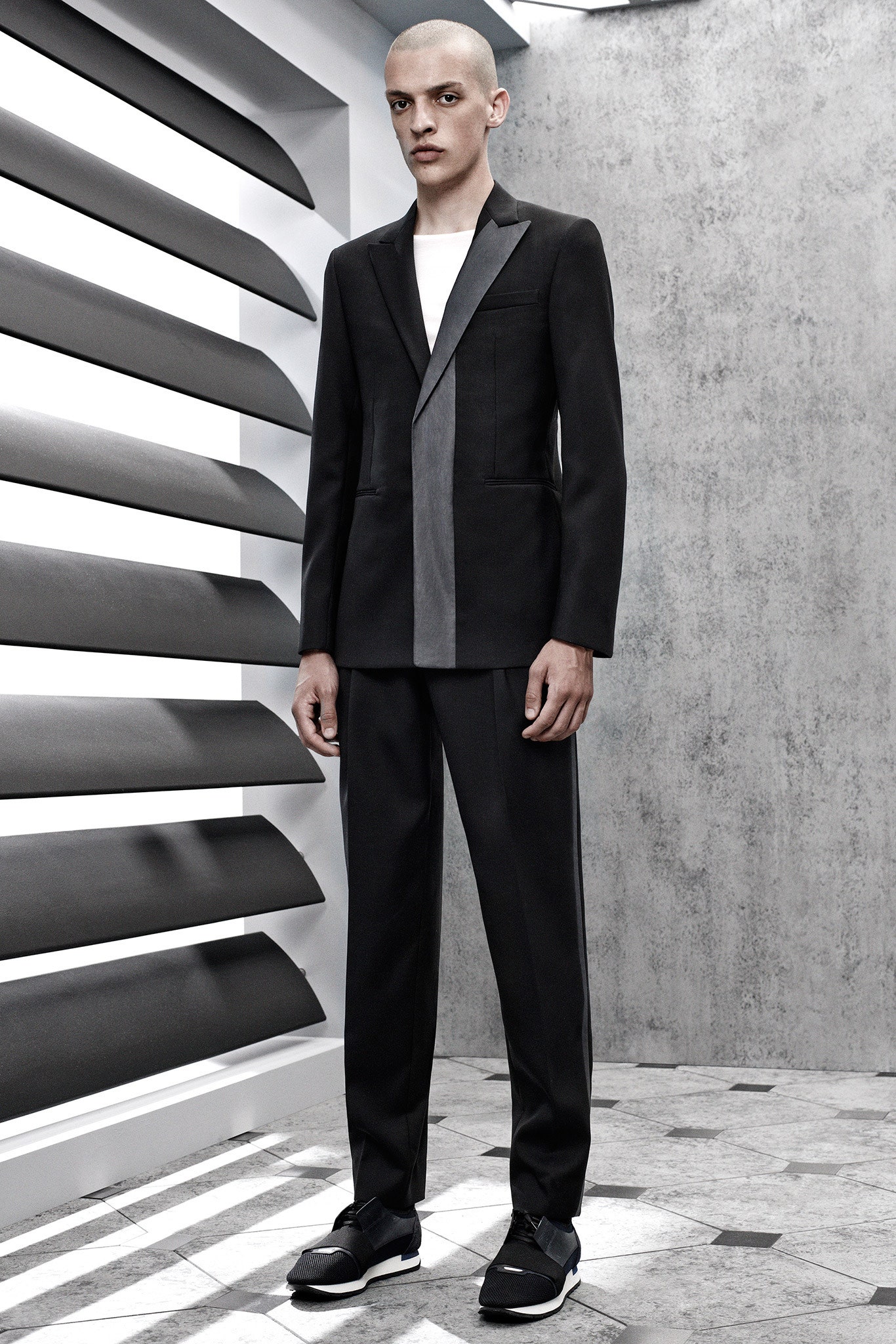 black and gray tailored suit with white t-shirt