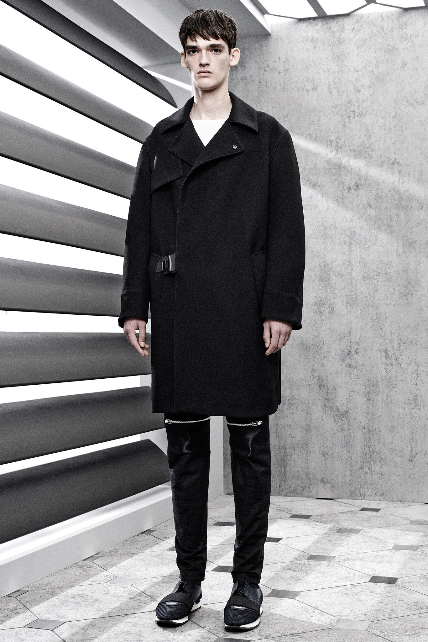 black wool coat and slim pants