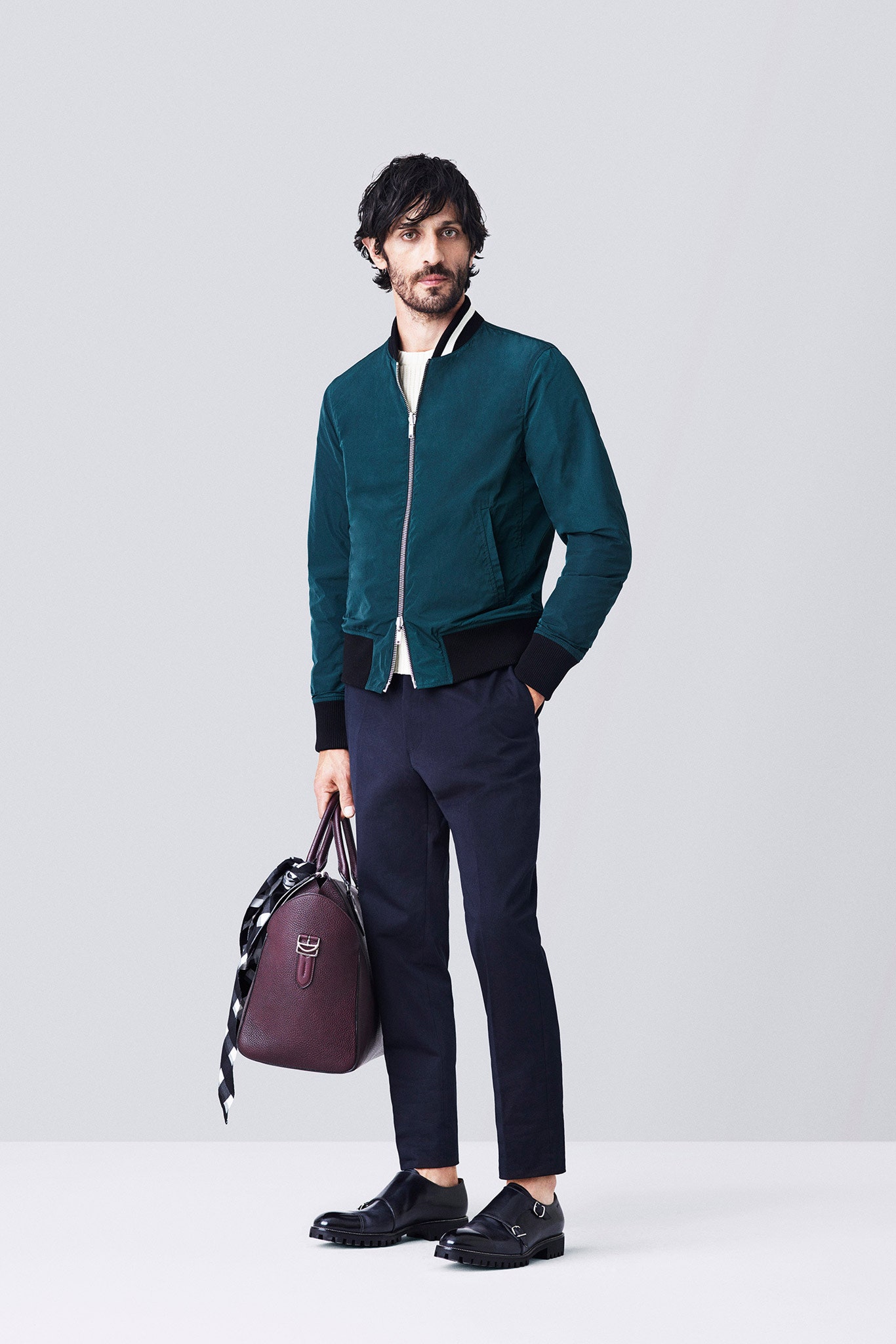 blue fitted jacket with black pants