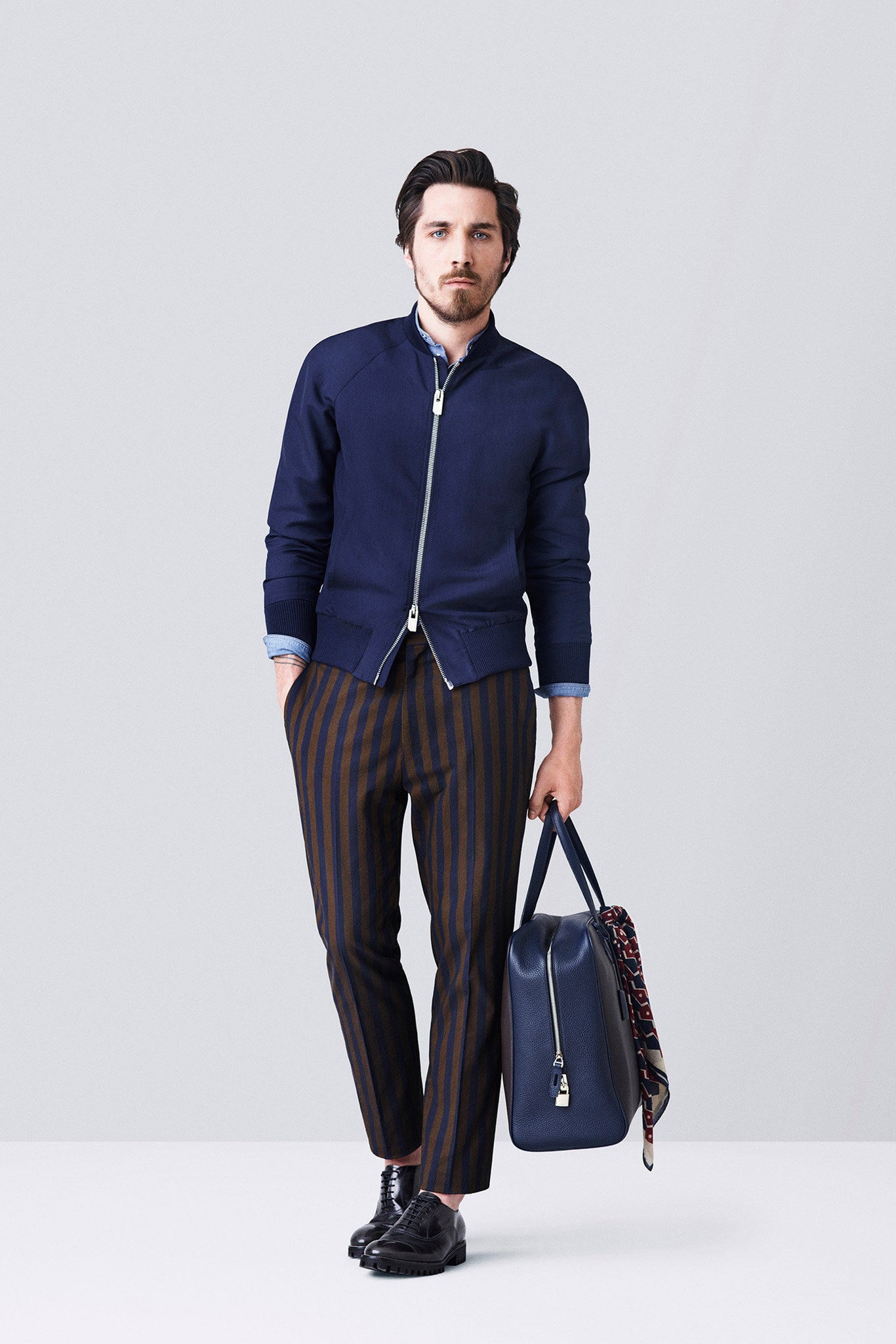 blue fitted jacket and striped pants