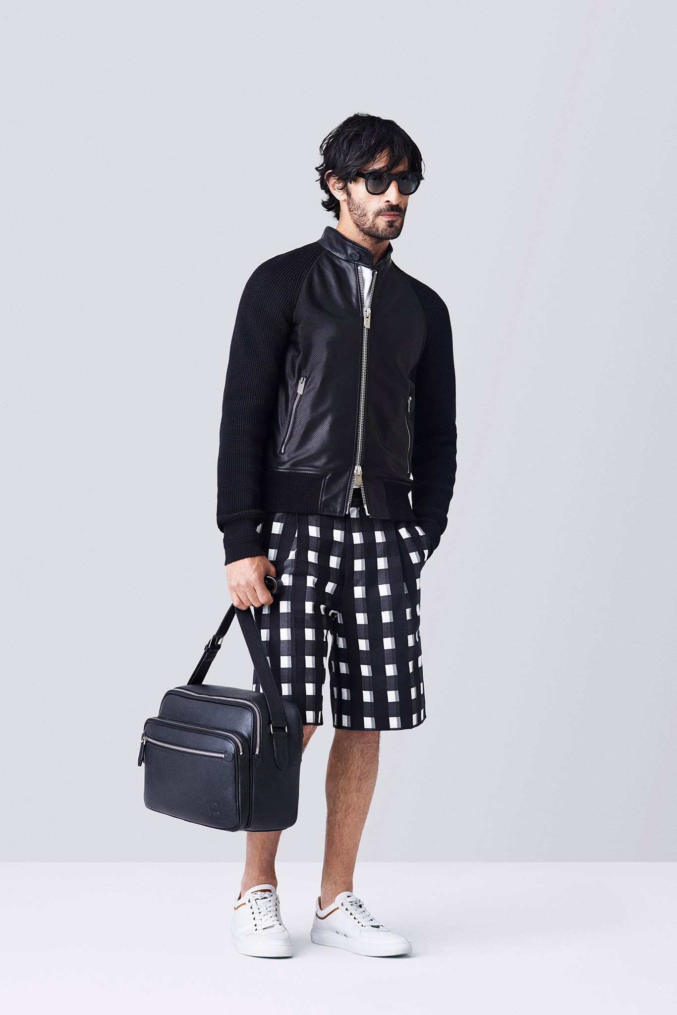 black leather fitted jacket with checked shorts