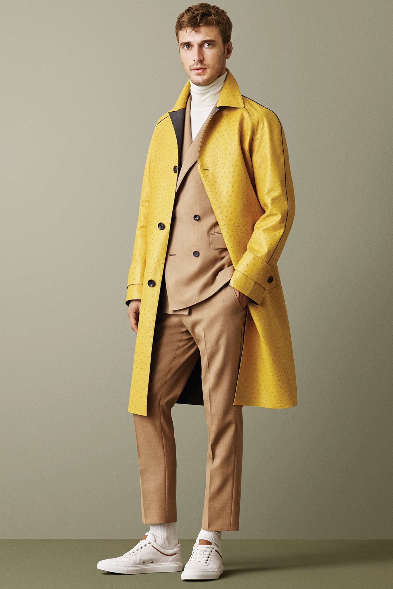 yellow vinyl coat with beige suit