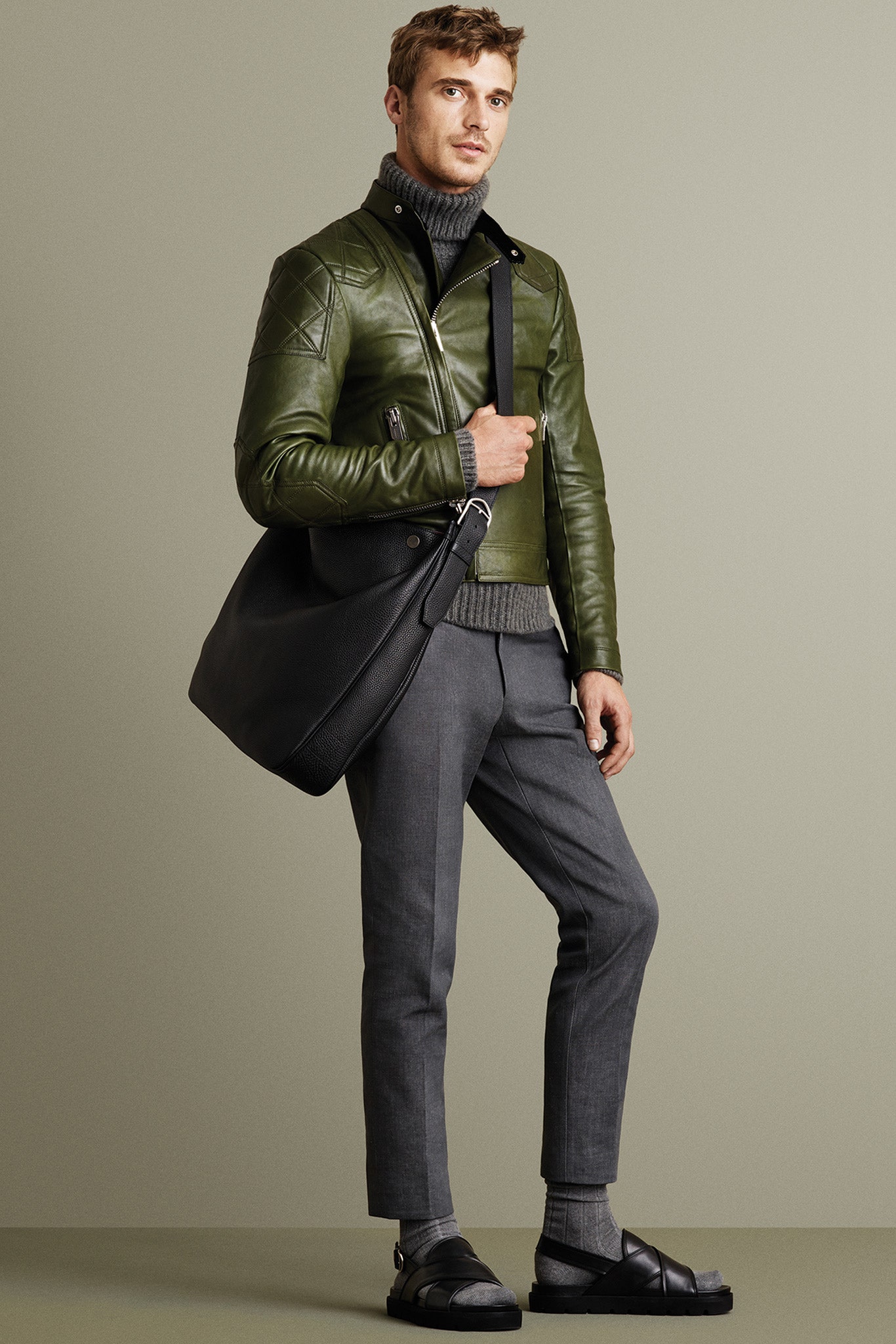 green leather jacket with gray sweater