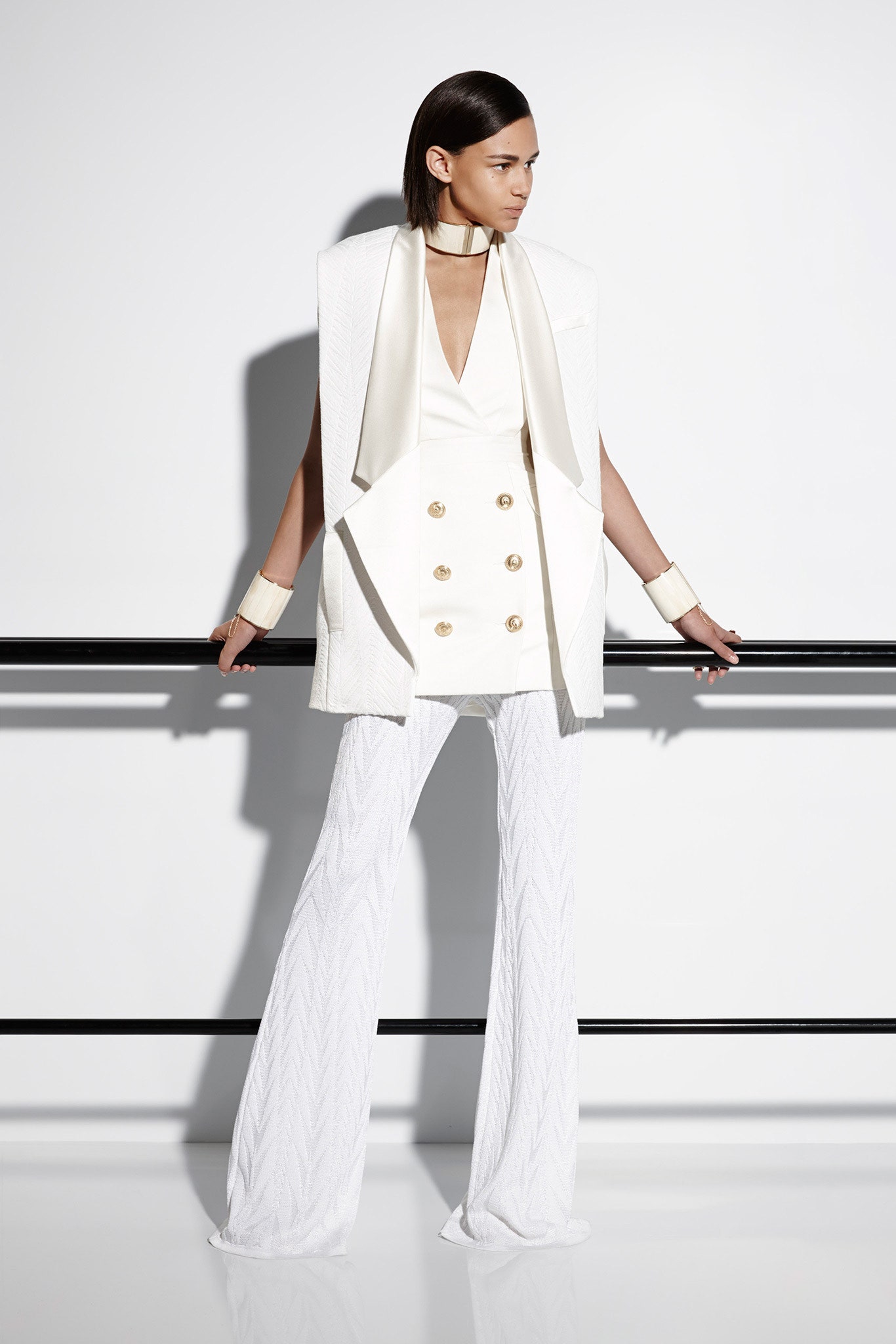 white fitted blazer and flared pants