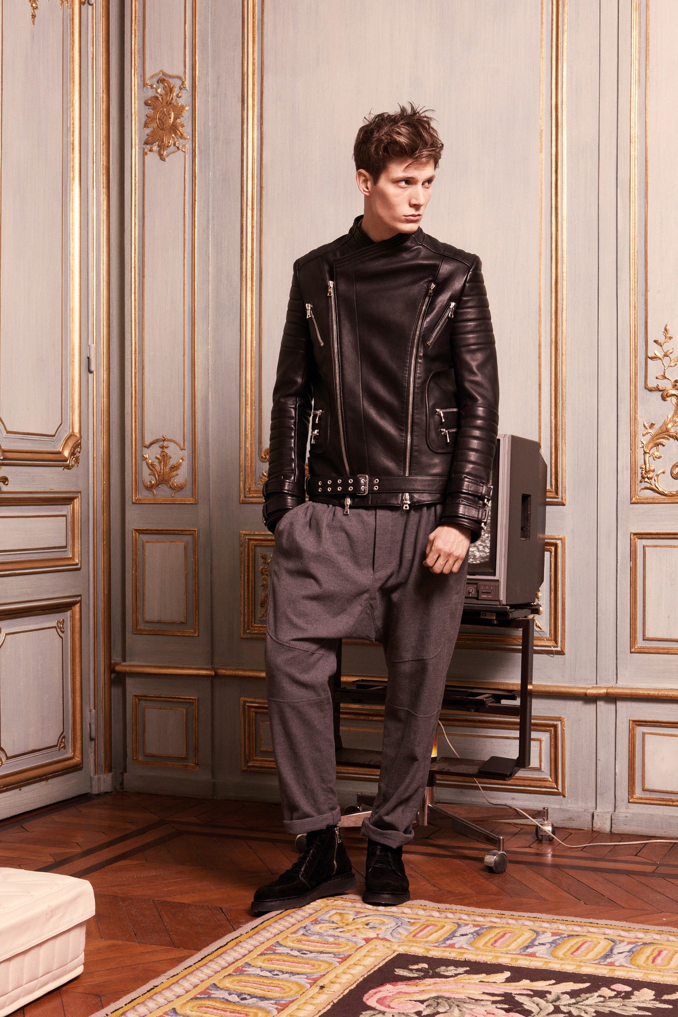 black leather long-sleeve high-neck fitted zippered buttoned jacket