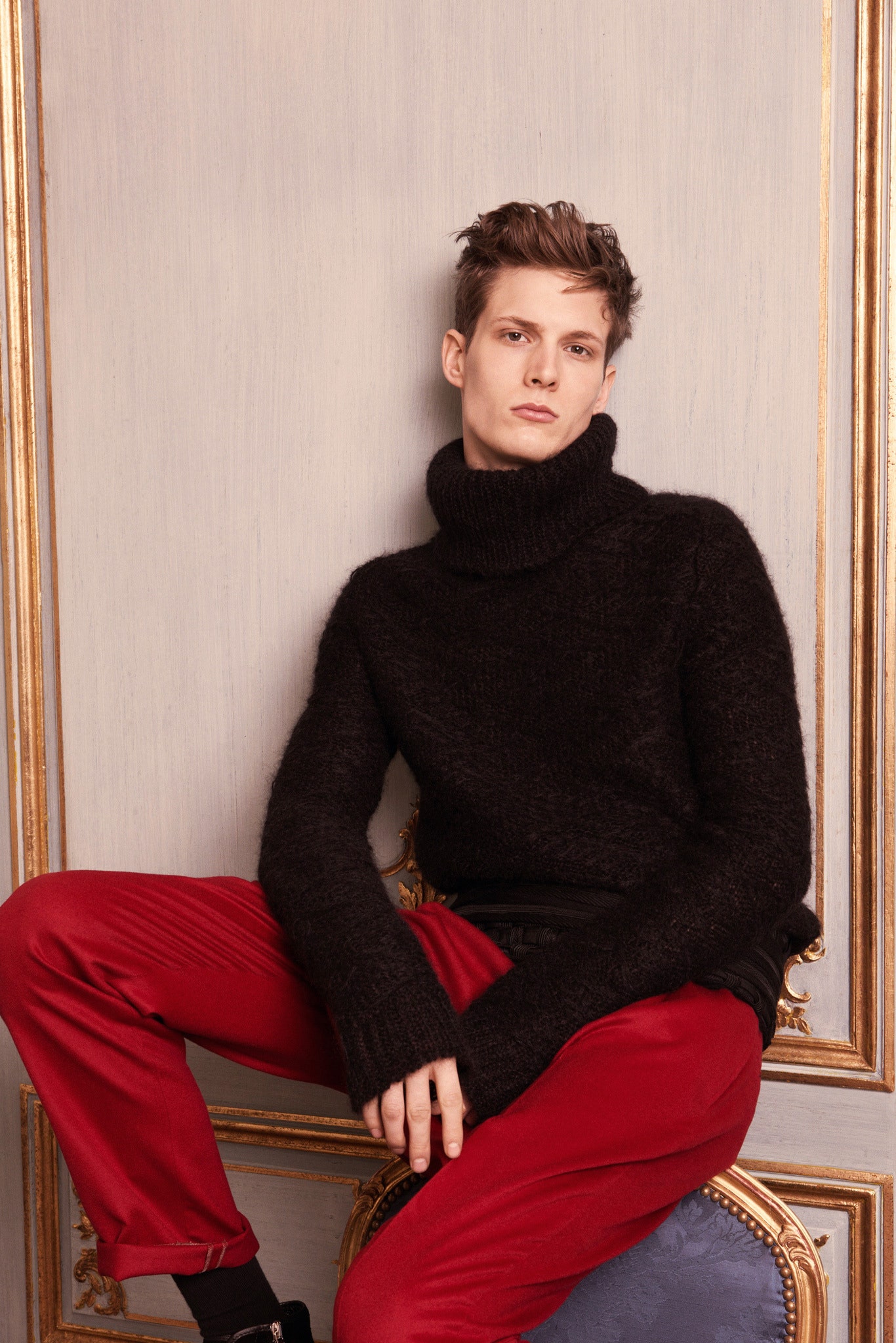 black wool turtleneck sweater and red pants