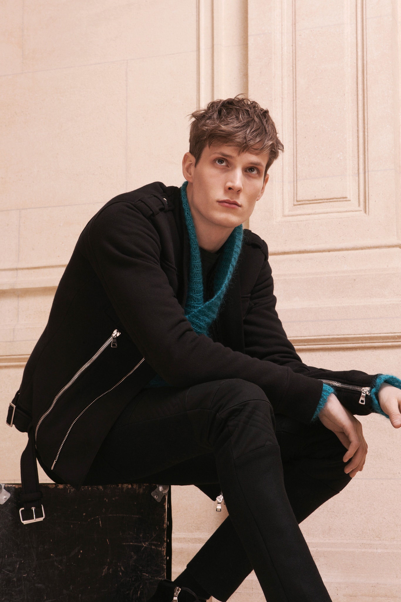 black fitted jacket blue sweater