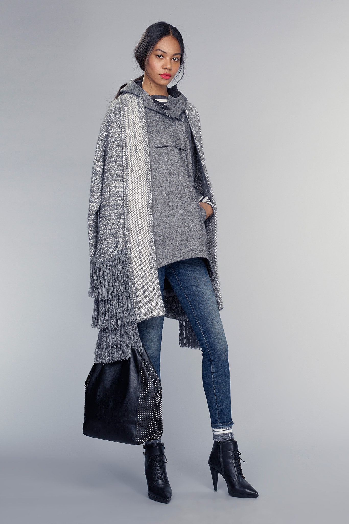 gray poncho with jeans and boots