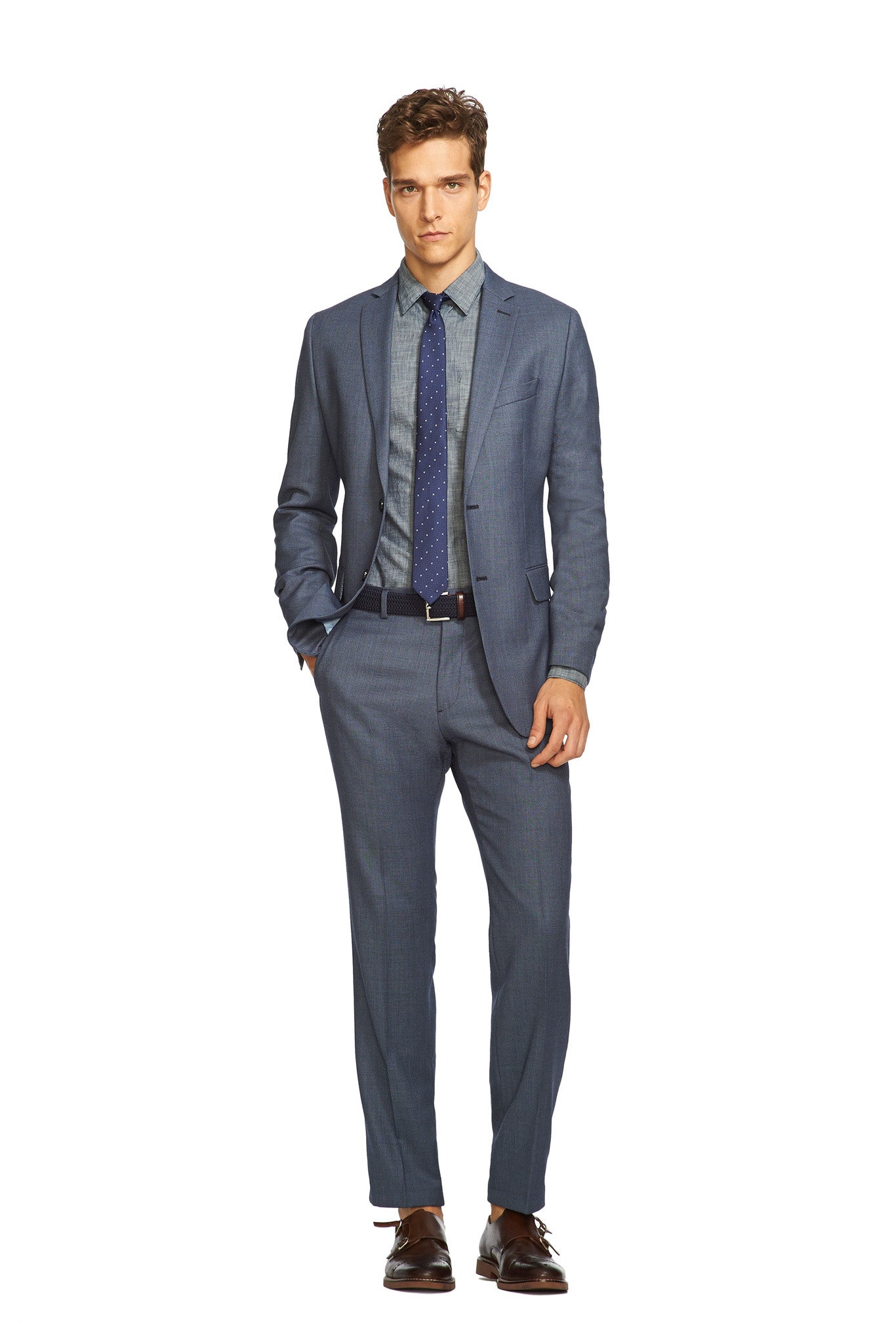 blue tailored suit with gray shirt