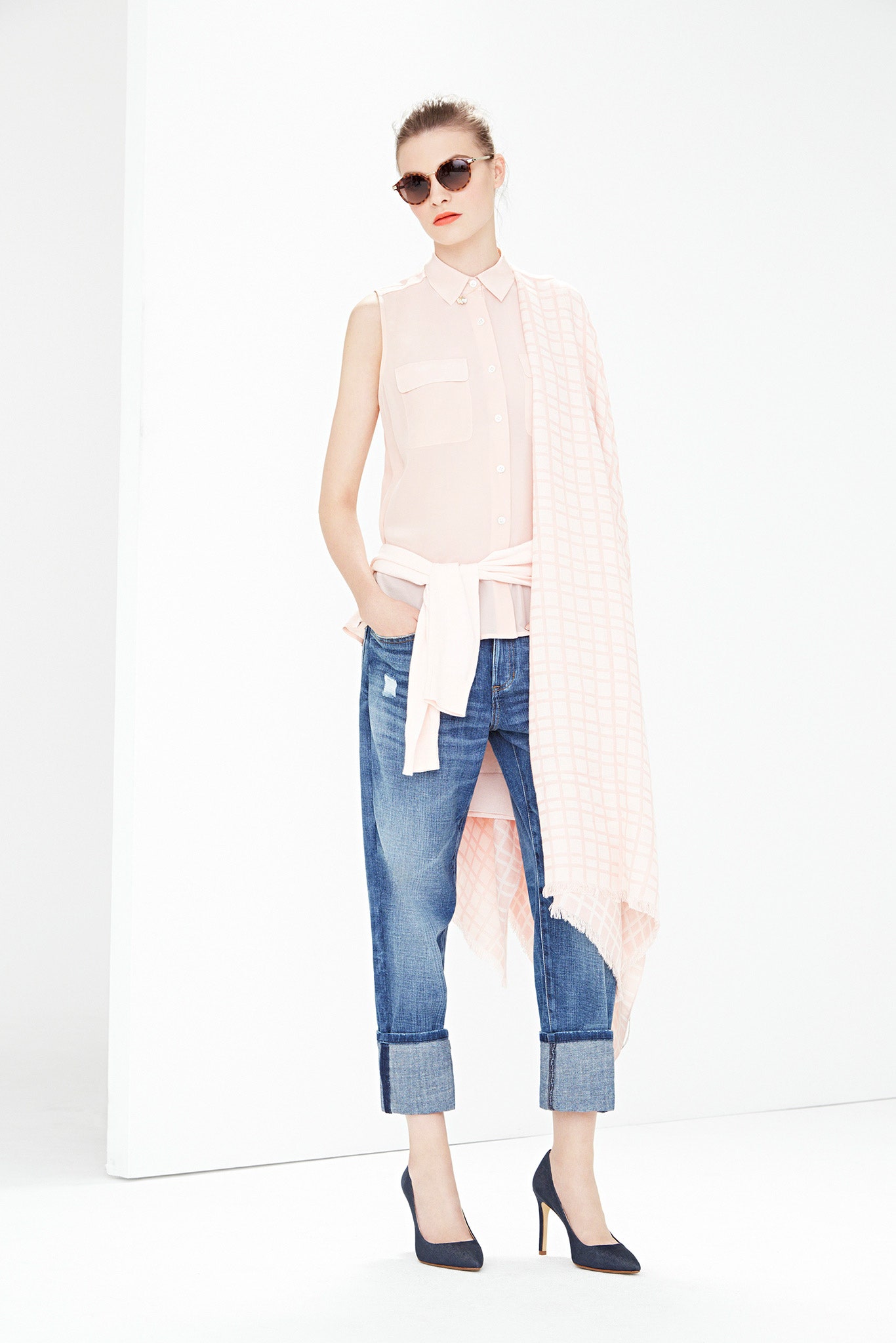pink sleeveless shirt with denim pants