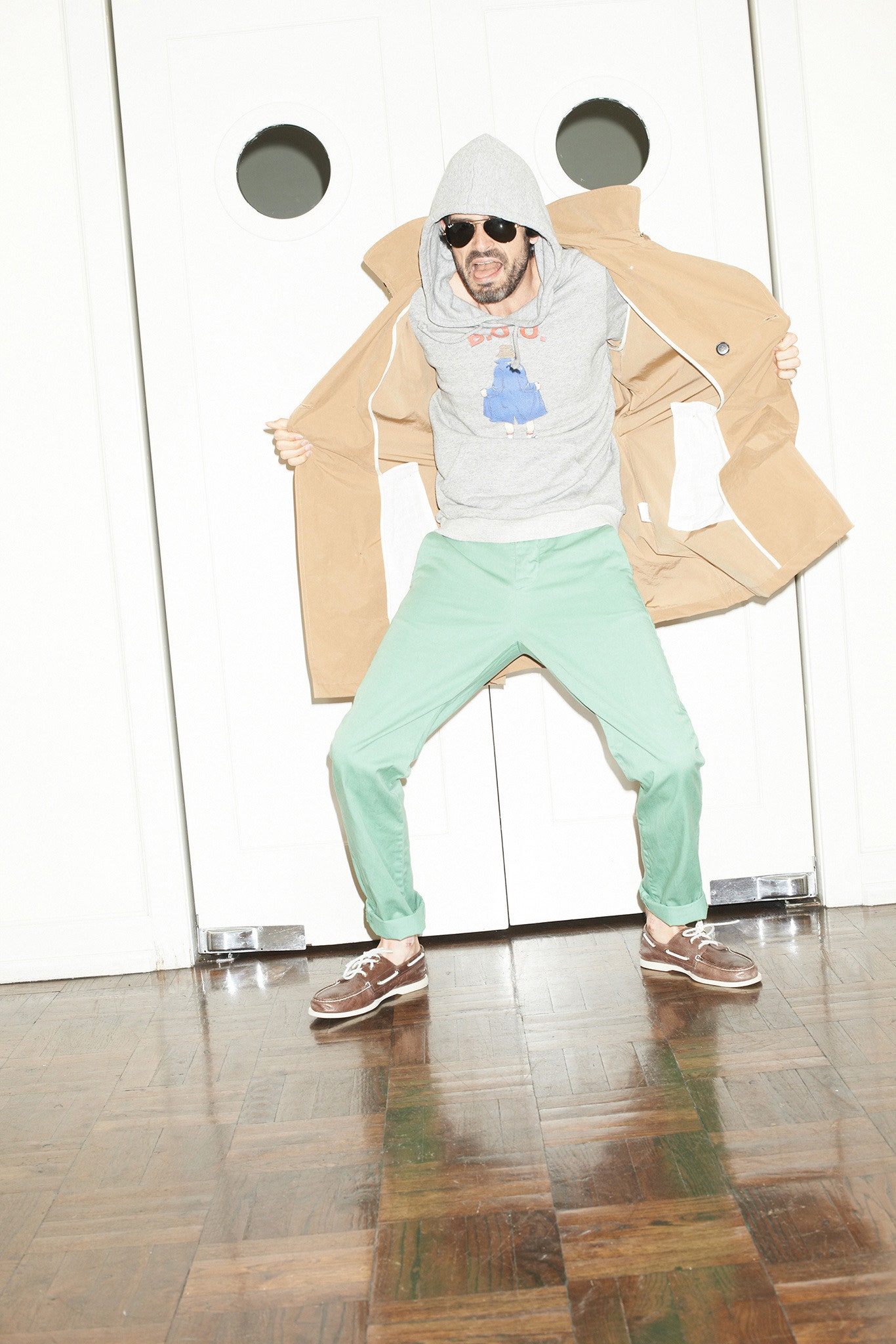 beige coat gray hoodie green pants