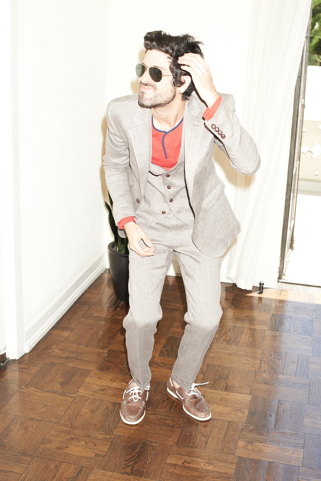 gray tailored suit with red t-shirt