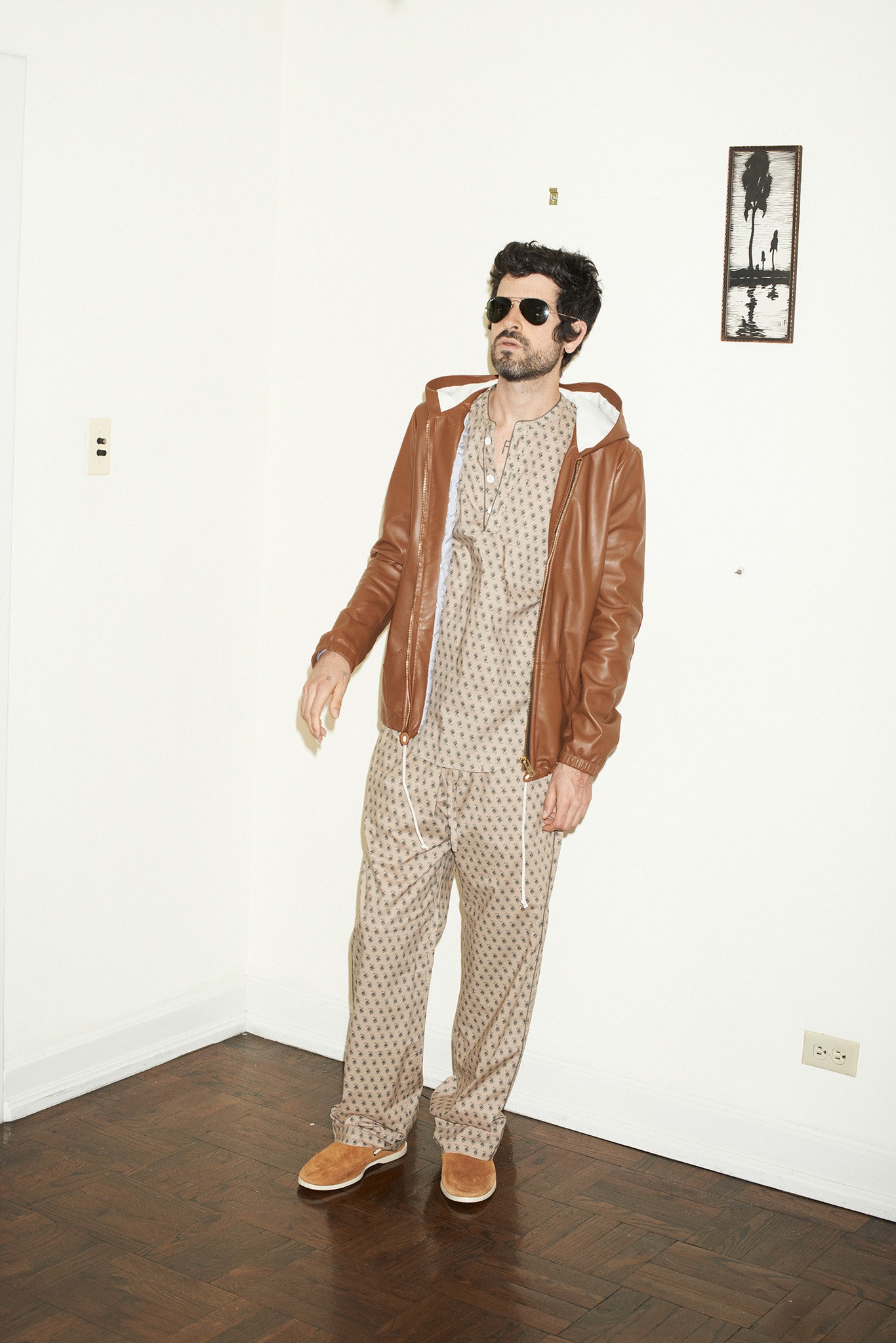brown leather jacket with printed pants